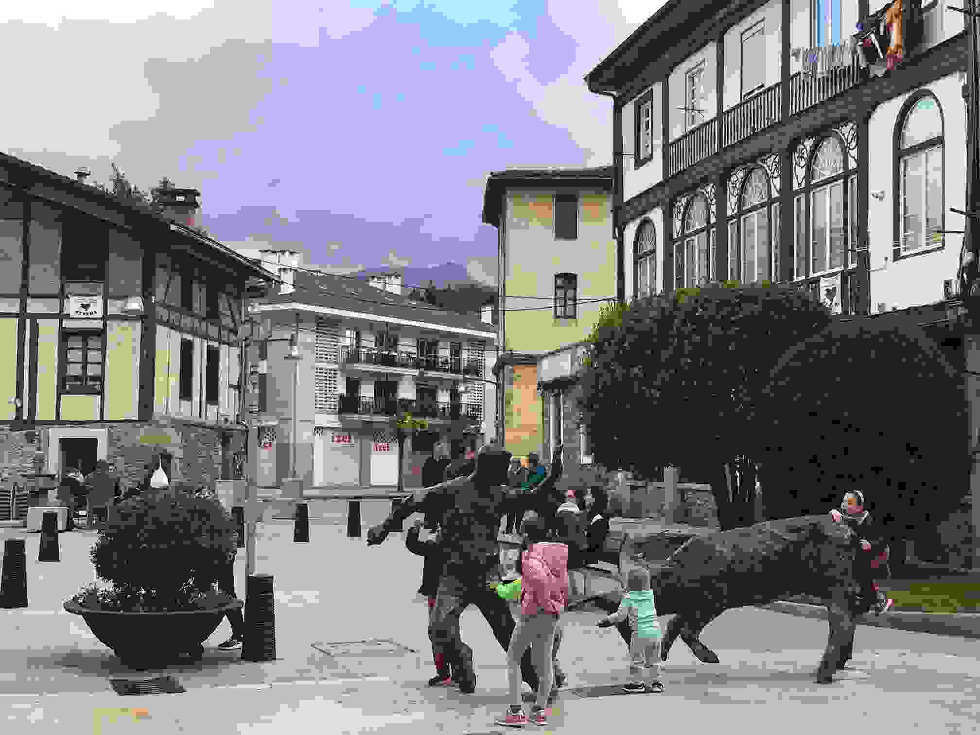 Kids playing in the evening in a square in Durango, Spain, during the long daylight hours of summer (Terry Ward).