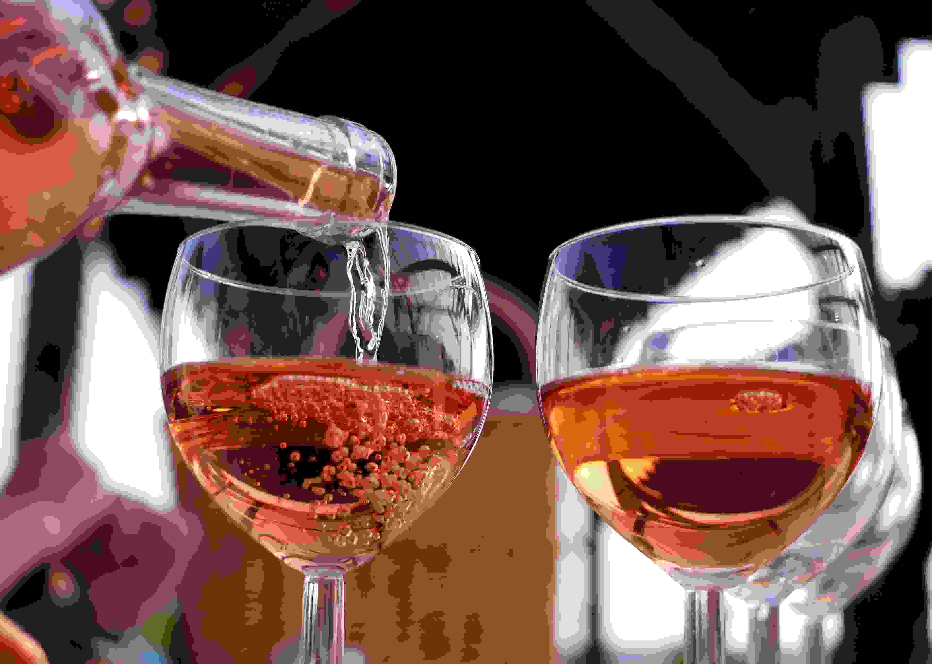 Rosé wine is poured into glasses at vineyard Klosterhof Toplitz in the sunshine in Toplitz, Germany, 10 September 2016. The ecologically managed vineyard has 2.5 hectars of land and a tavern selling homegrown vine. Pinot gris and pinot blanc, riesling and regent are cultivated here. Photo: Jens Kalaene/dpa | usage worldwide (Photo by Jens Kalaene/picture alliance via Getty Images)