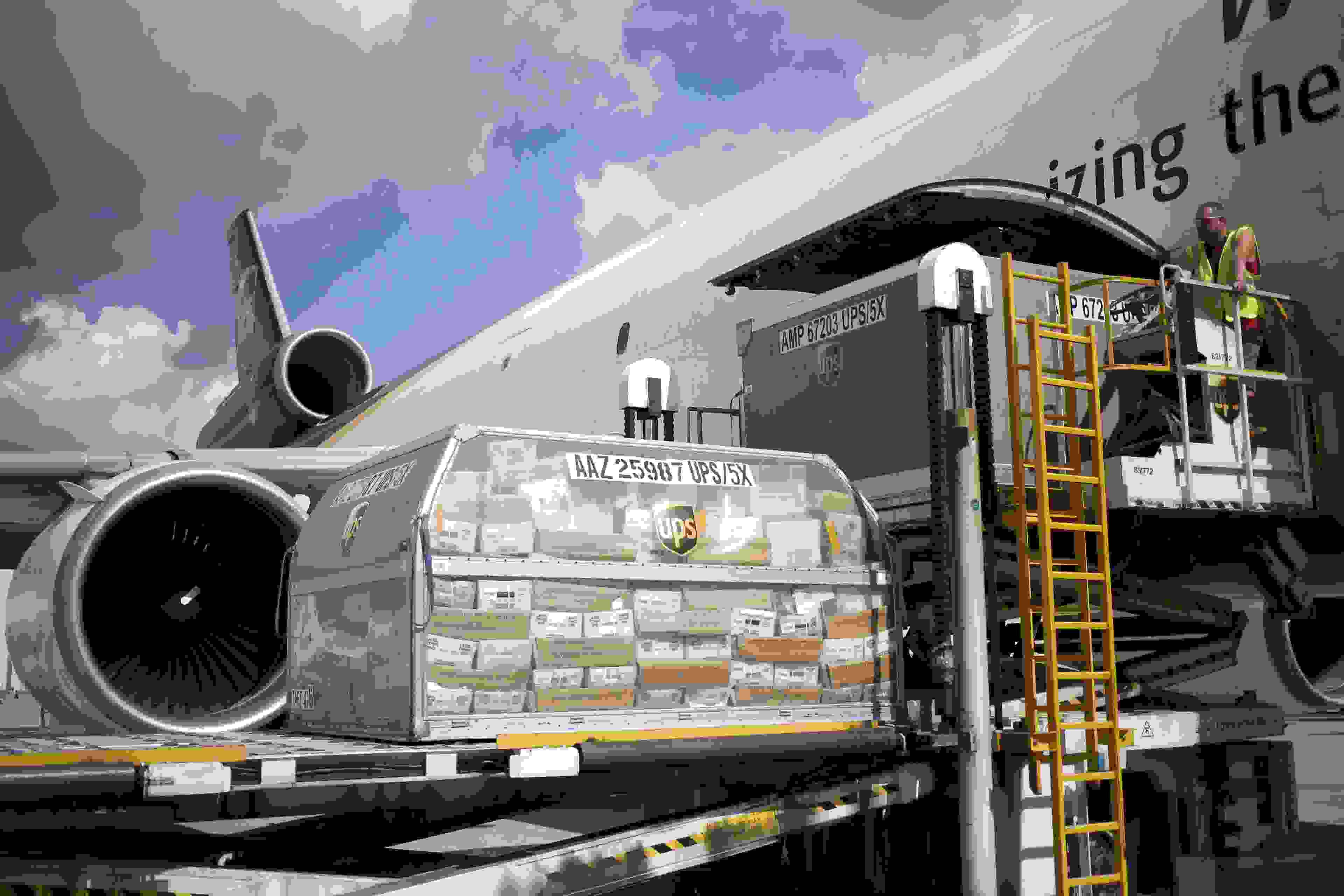 A shipping container of United States Postal Service (USPS) mail is loaded onto a cargo jet on the tarmac at the United Parcel Service Inc. (UPS) Worldport facility in Louisville, Kentucky, U.S., on Friday, Oct. 5, 2018. UPS is scheduled to release earnings figures on October 24. Photographer: Luke Sharrett/Bloomberg via Getty Images