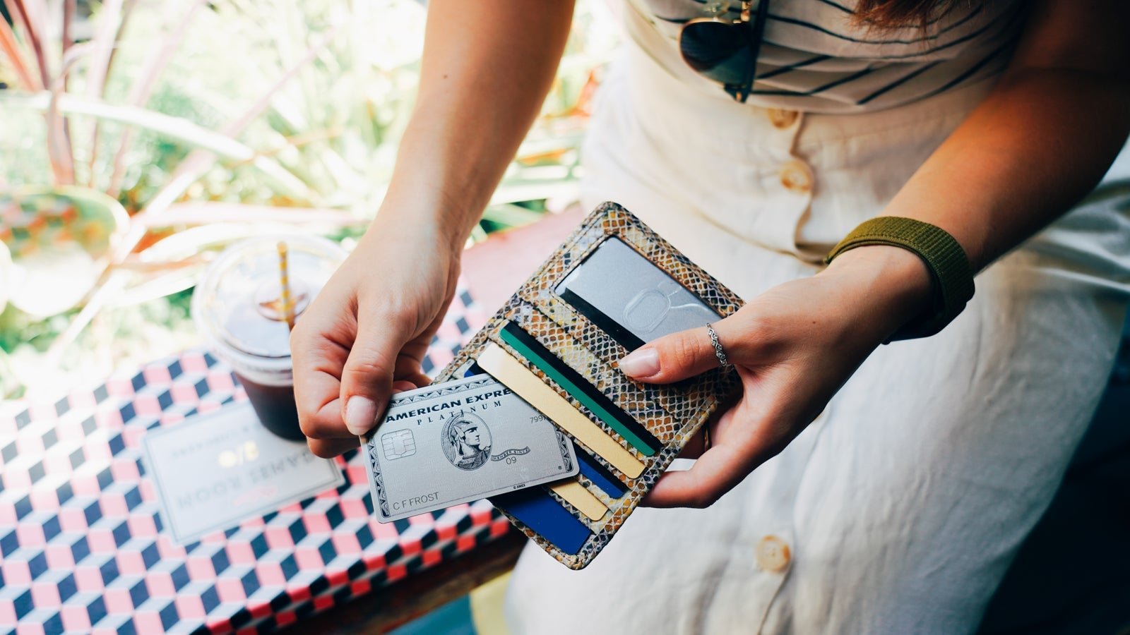 Woman removes card from wallet