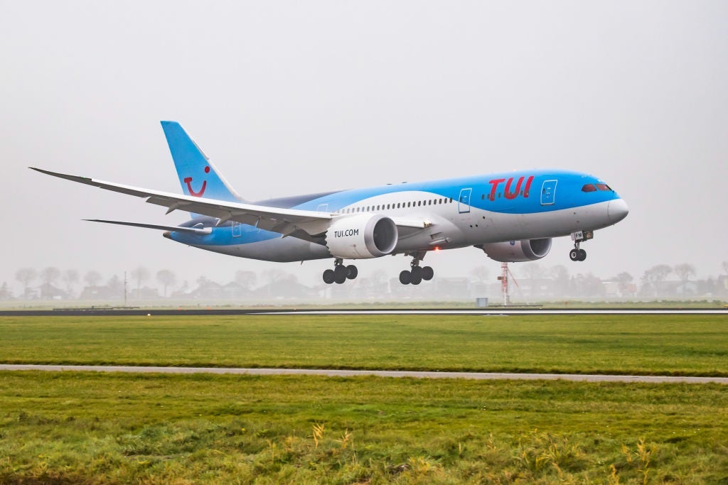 TUI Airlines Netherlands Boeing 787-8 Dreamliner landing in the mist in Amsterdam Schiphol International Airport. The aircraft registration is PH-TFM. TUI uses Amsterdam Airport as a hub and connects Amsterdam to popular tourist destinations. (Photo by Nicolas Economou/NurPhoto via Getty Images)