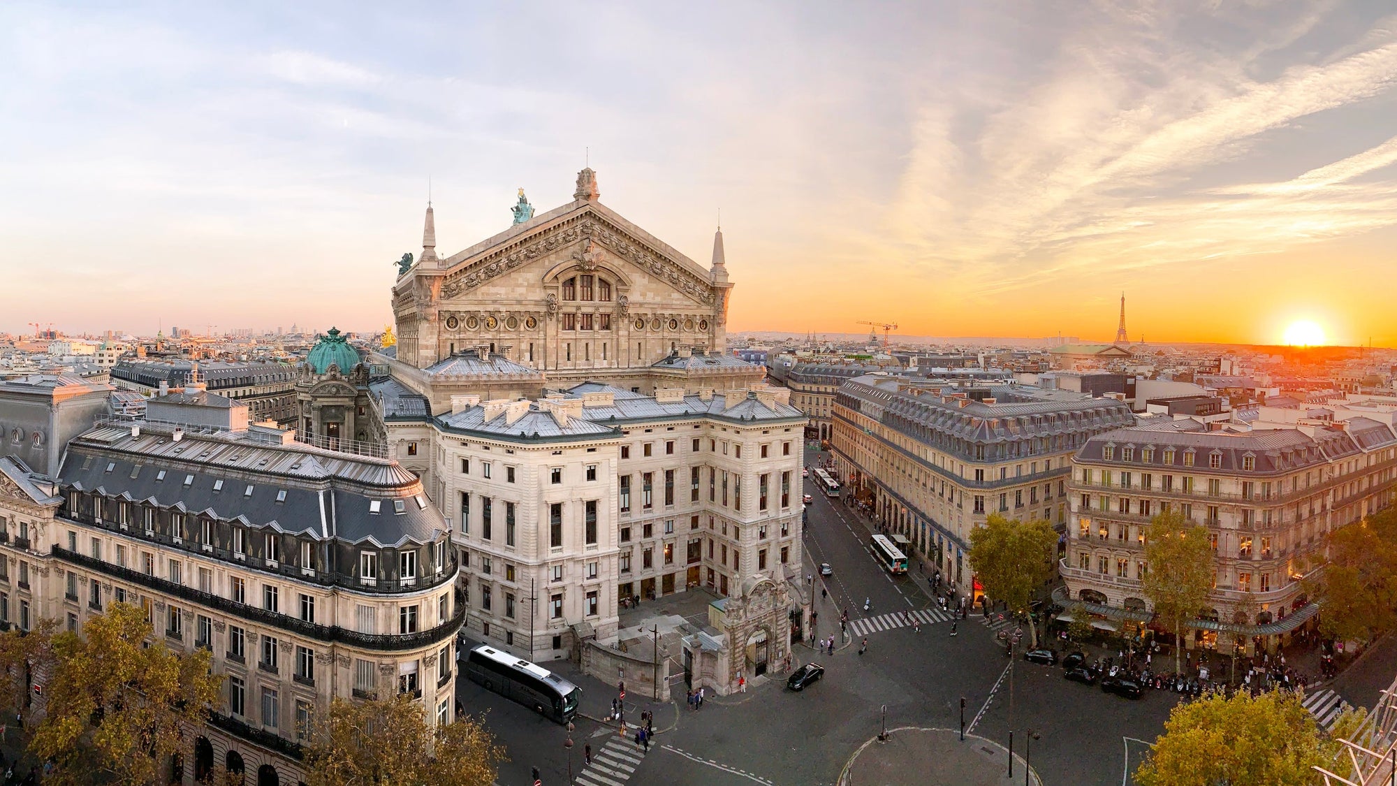 Panoramic view of Paris skyline with Garnier Opera and Eiffel Tower during sunset, Paris, France