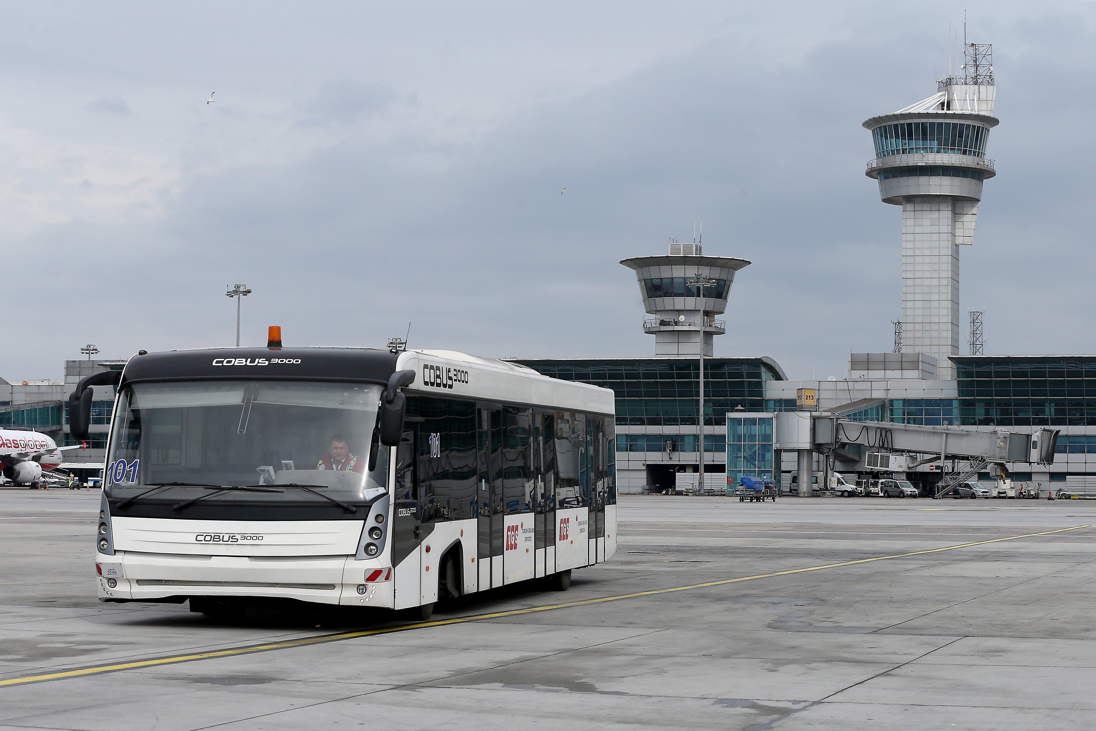 A bus is seen at Ataturk Airport, which is planned to be closed for commercial flights after transference period to Istanbul Airport had been completed, in Istanbul, Turkey on March 22, 2019. Ataturk Airport, which is short of 24 km from the city center, was used for international charter flights for years after coming into service for military purposes in 1912 in Yesilkoy. Civil aviations started in Yesilkoy Airfield in 1933 between Istanbul-Ankara after the military hangar and masonry were assigned to civil aviation. The airport was decided to be an international airport with the purpose of development of Turkish civil aviation with Convention on International Civil Aviation, which was sign on 1944 in Chicago. Construction of the airport had started in 1949 and was completed in 1953 and started its international flights.