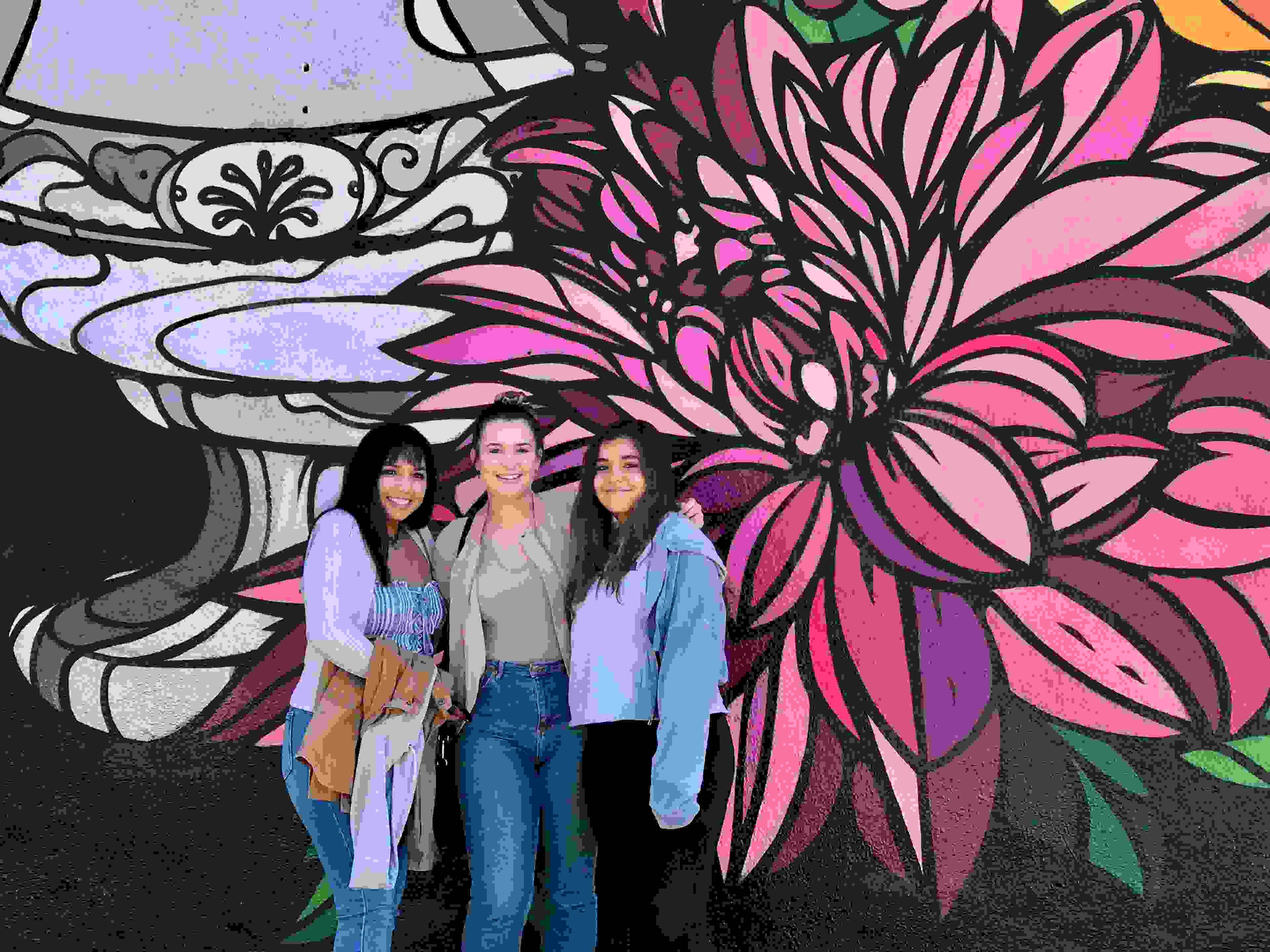 These girls loved posing in front of various murals on Melrose Avenue. (Photo courtesy of 2DadsWithBaggage)