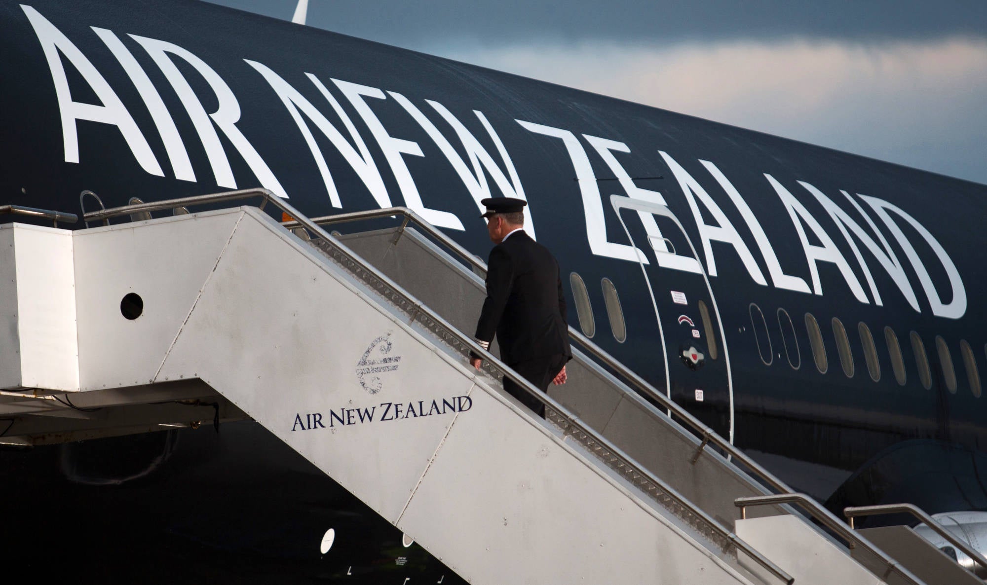 David Morgan, chief pilot at Air New Zealand, walks onboard the first Boeing 787-9 Dreamliner to be operated by the carrier at Auckland International Airport on July 11, 2014. (Photo by Brendon O'Hagan/Bloomberg via Getty Images)