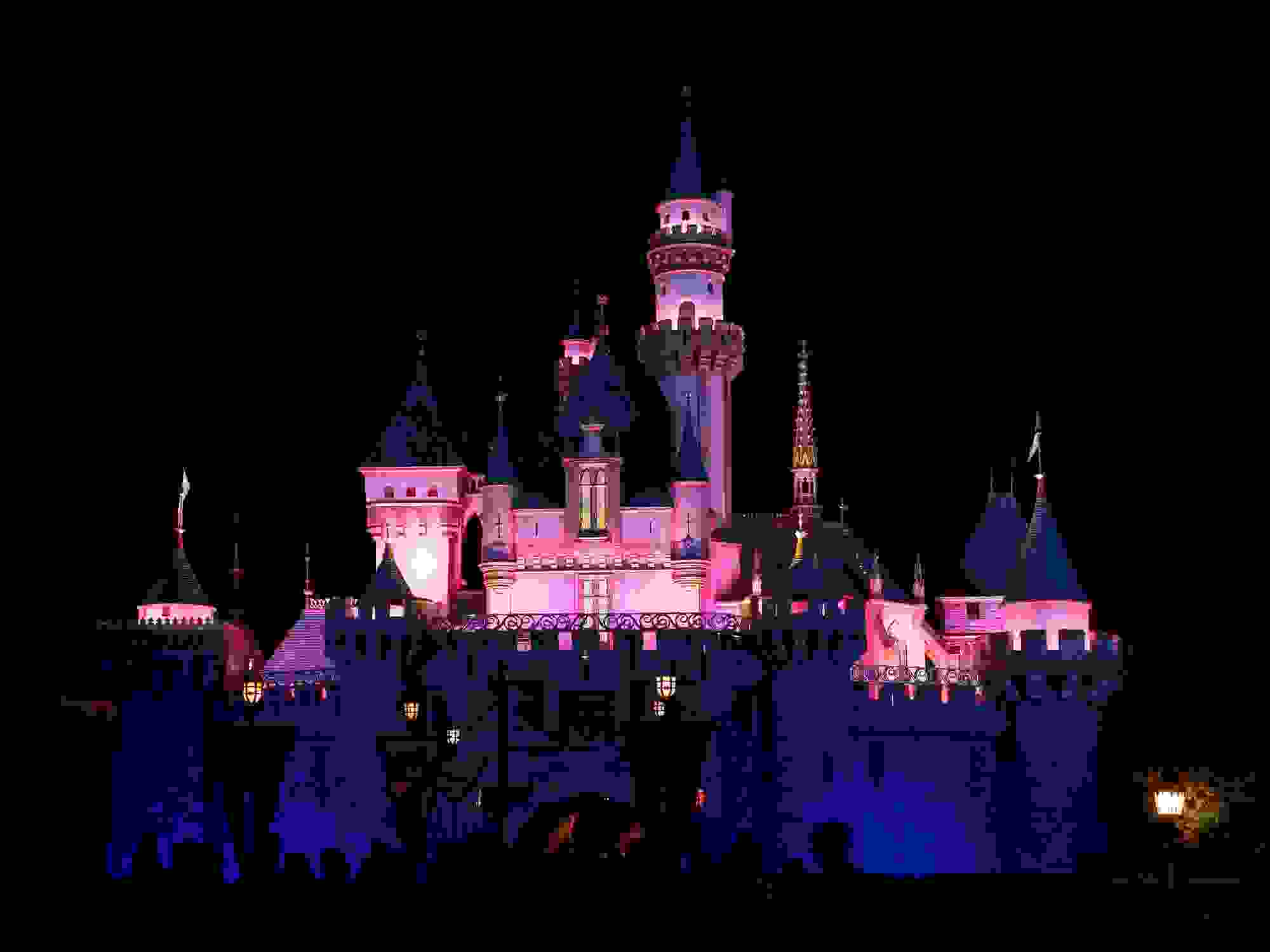 Exterior image of entrance to Sleeping Beauty Castle in Disneyland as seen at night.