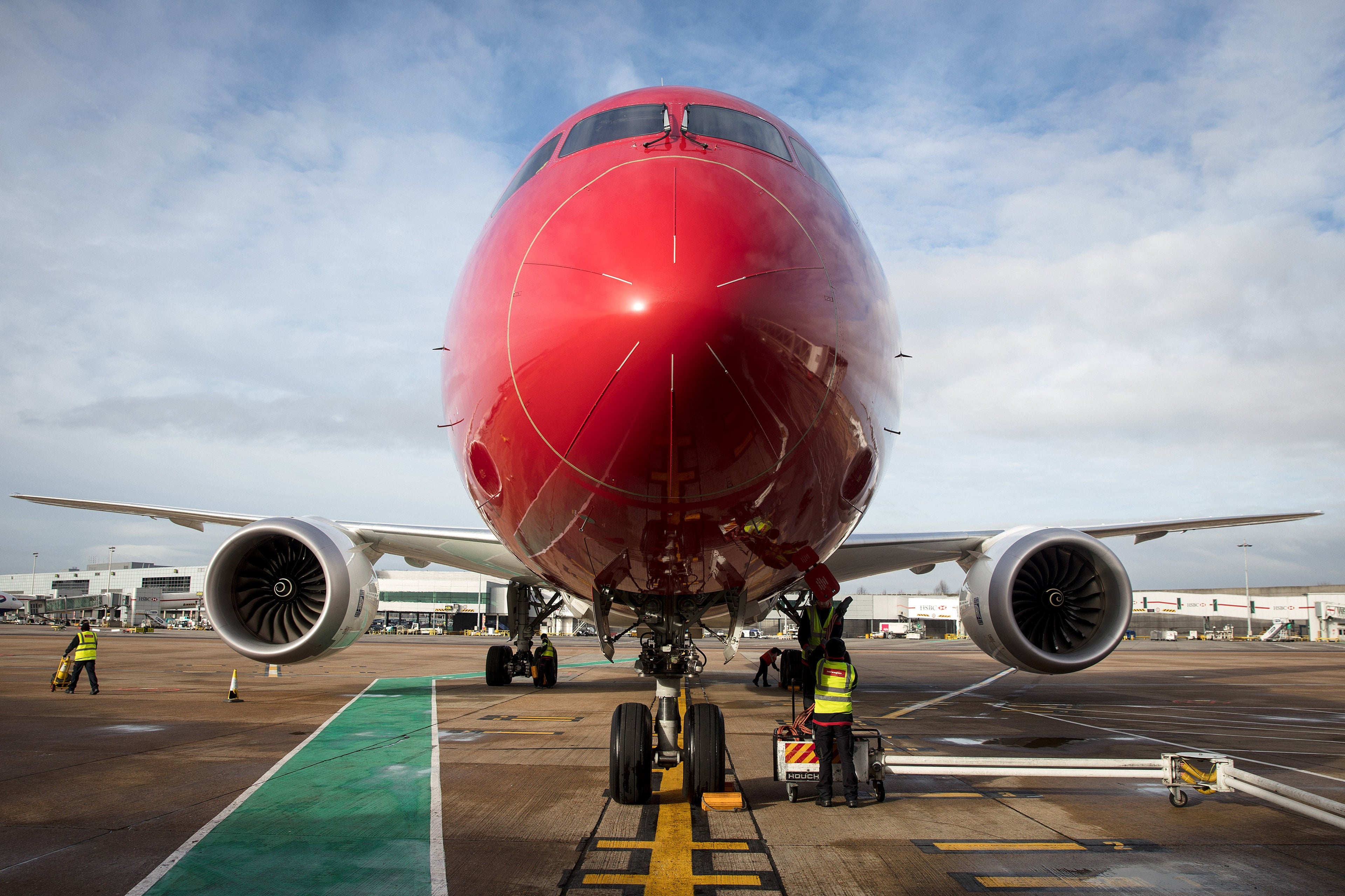 An employee checks on a Norwegian Air Boeing 787 Dreamliner at London Gatwick Airport on Jan. 10, 2017. (Photo by Simon Dawson/Bloomberg via Getty Images)