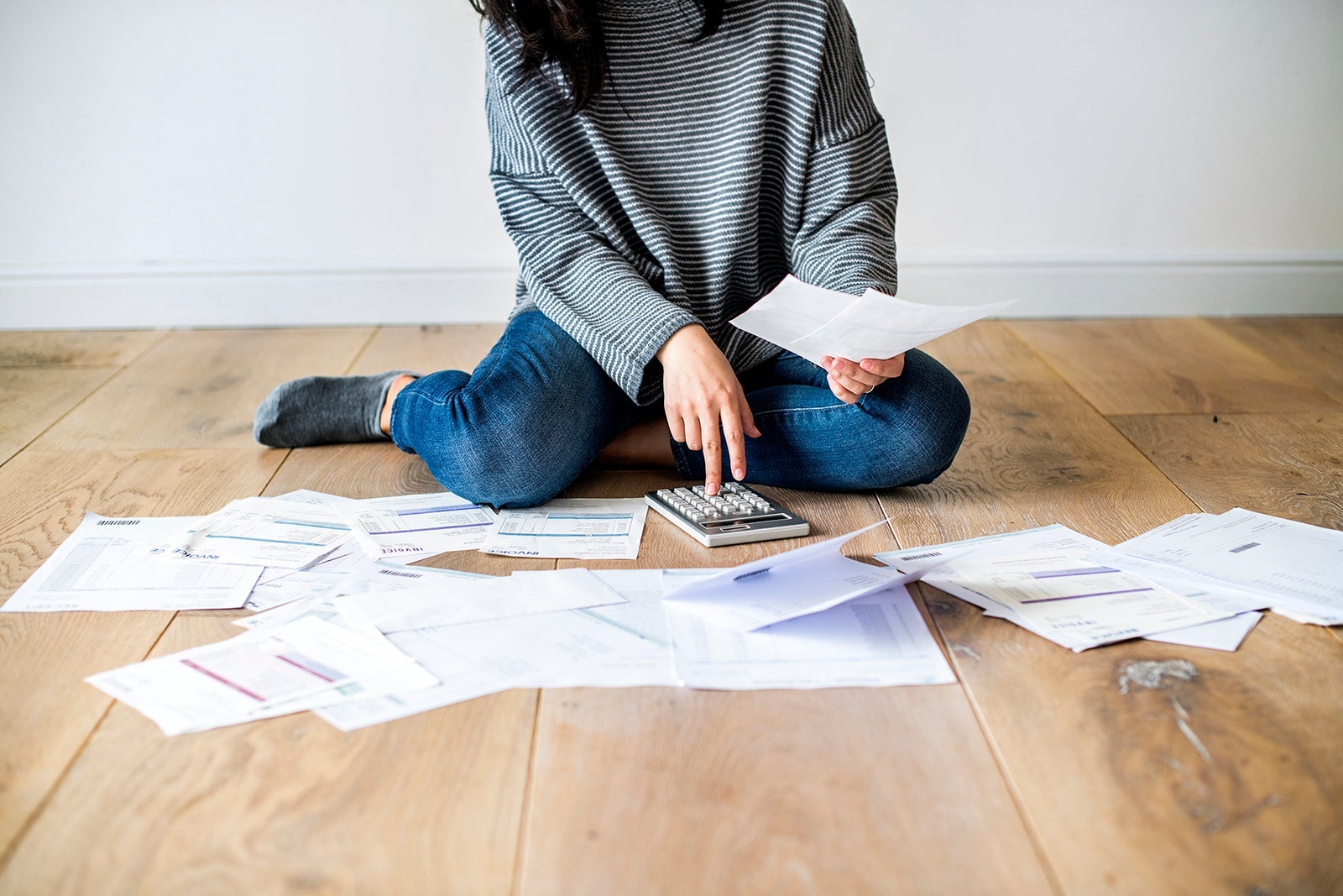Woman managing the debt***These documents are our own generic designs. They do not infringe on any copyrighted designs. Photo by Rawpixel/Getty Images