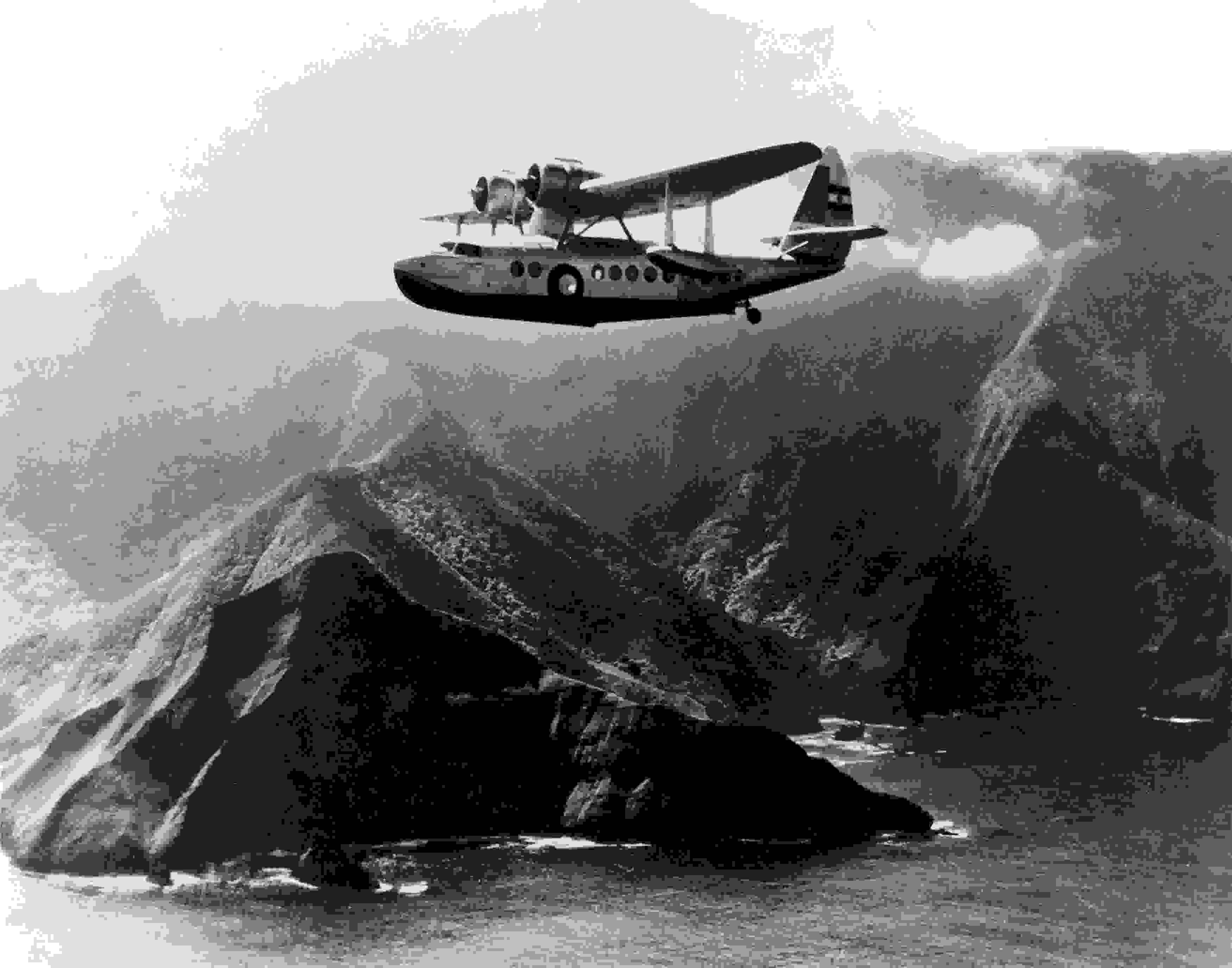 Inter-Island Airways (now Hawaiian Airlines) Sikorsky S-43 in flight past an unidentified mountainous coastline somewhere in the Hawaiian Islands circa 1935–1940. (Photo courtesy of National Air and Space Museum, Smithsonian Institution)