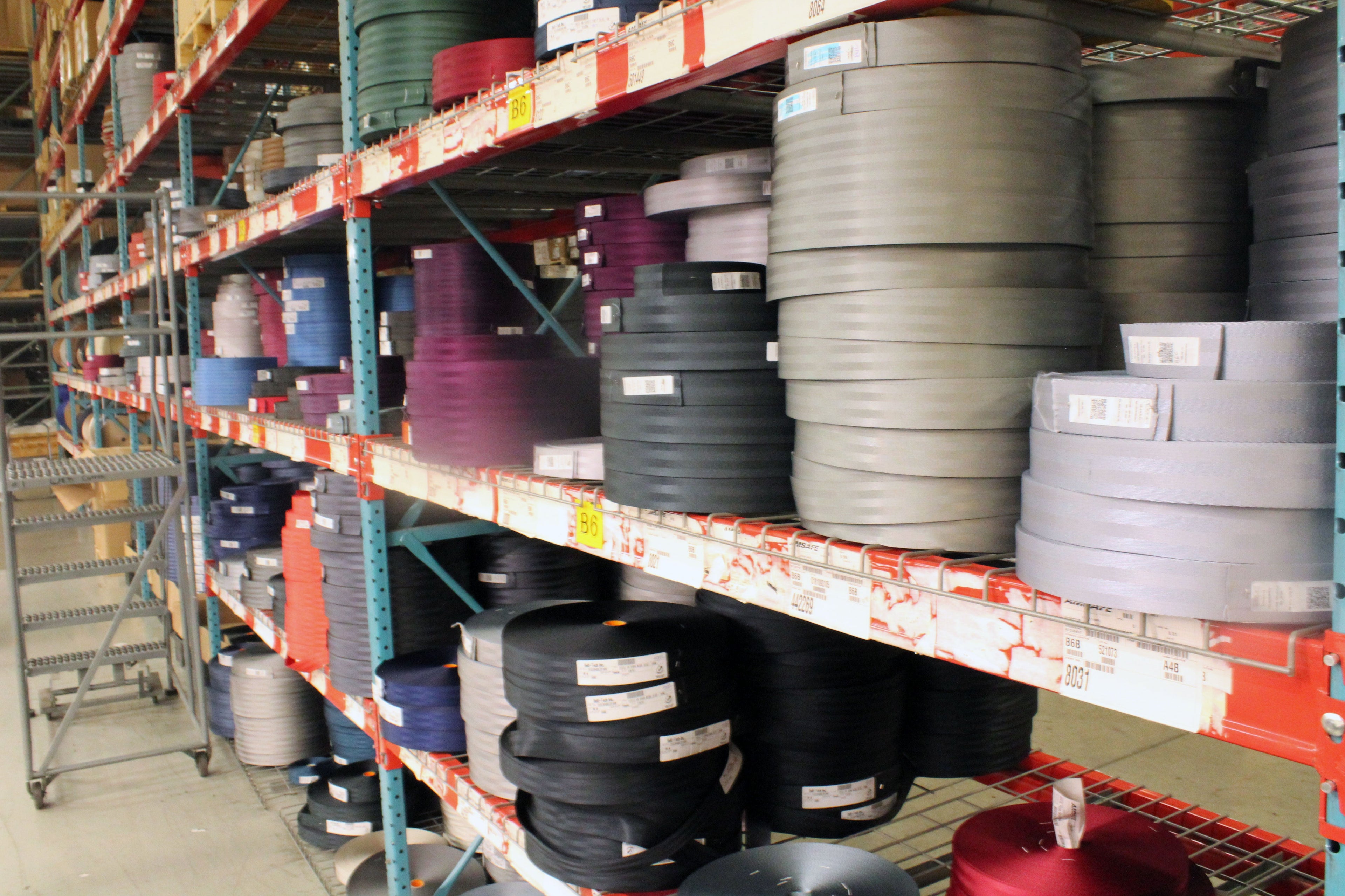 Bolts of webbing, in the preferred colors of AmSafe's airline clients.