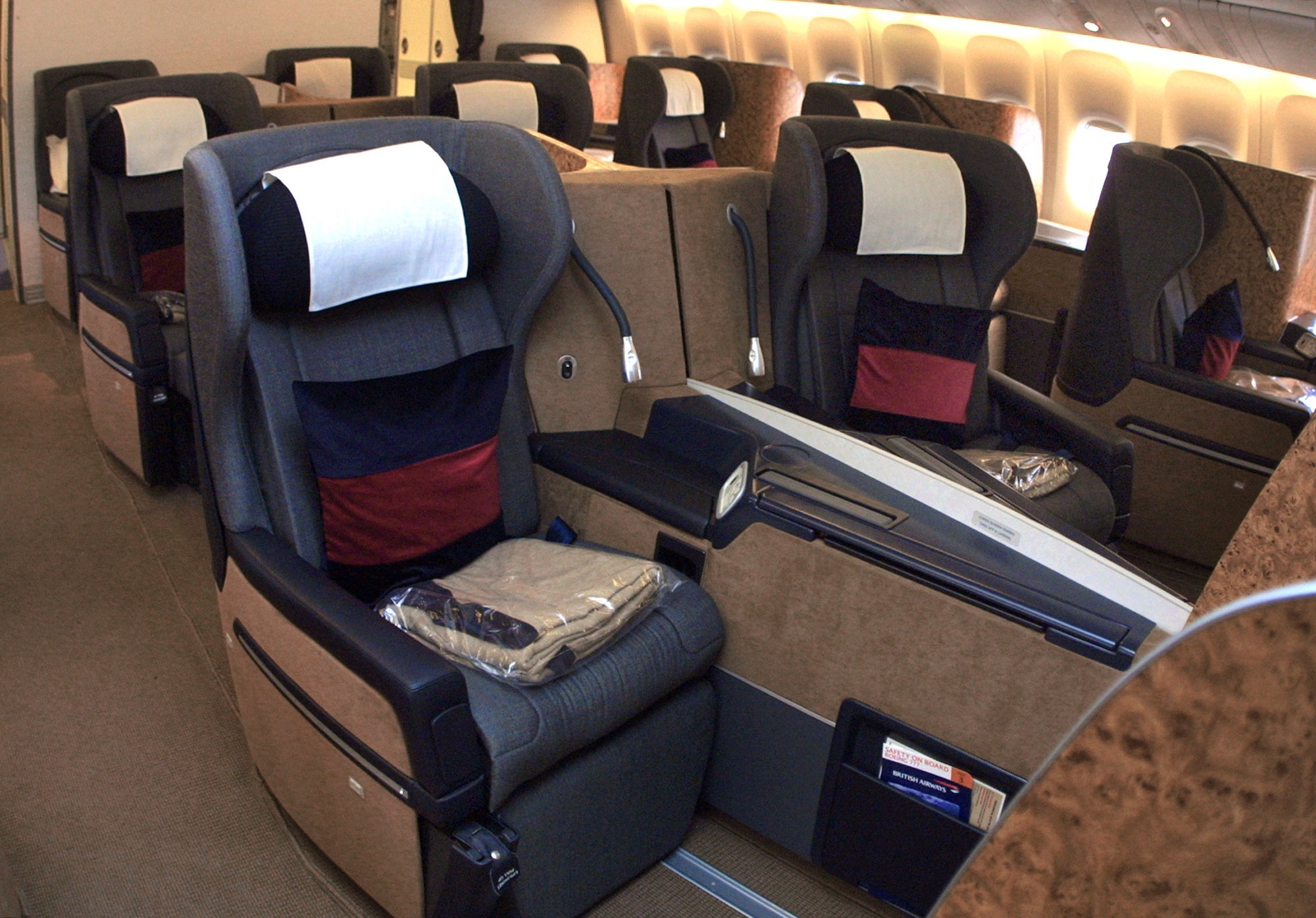 383015 04: The new British Airways first class cabin with seats that open into a fully flat beds is debuted December 7, 2000 in a Boeing 777 jet at O''Hare International Airport in Chicago. British Airways was unveiling their new "First Business Bedroom in the Sky" Boeing 777 aircraft. The jet with 62 beds, christened "The City of Chicago," arrived at O''Hare Airport nonstop from London-Heathrow. (Photo by Tim Boyle/Newsmakers)