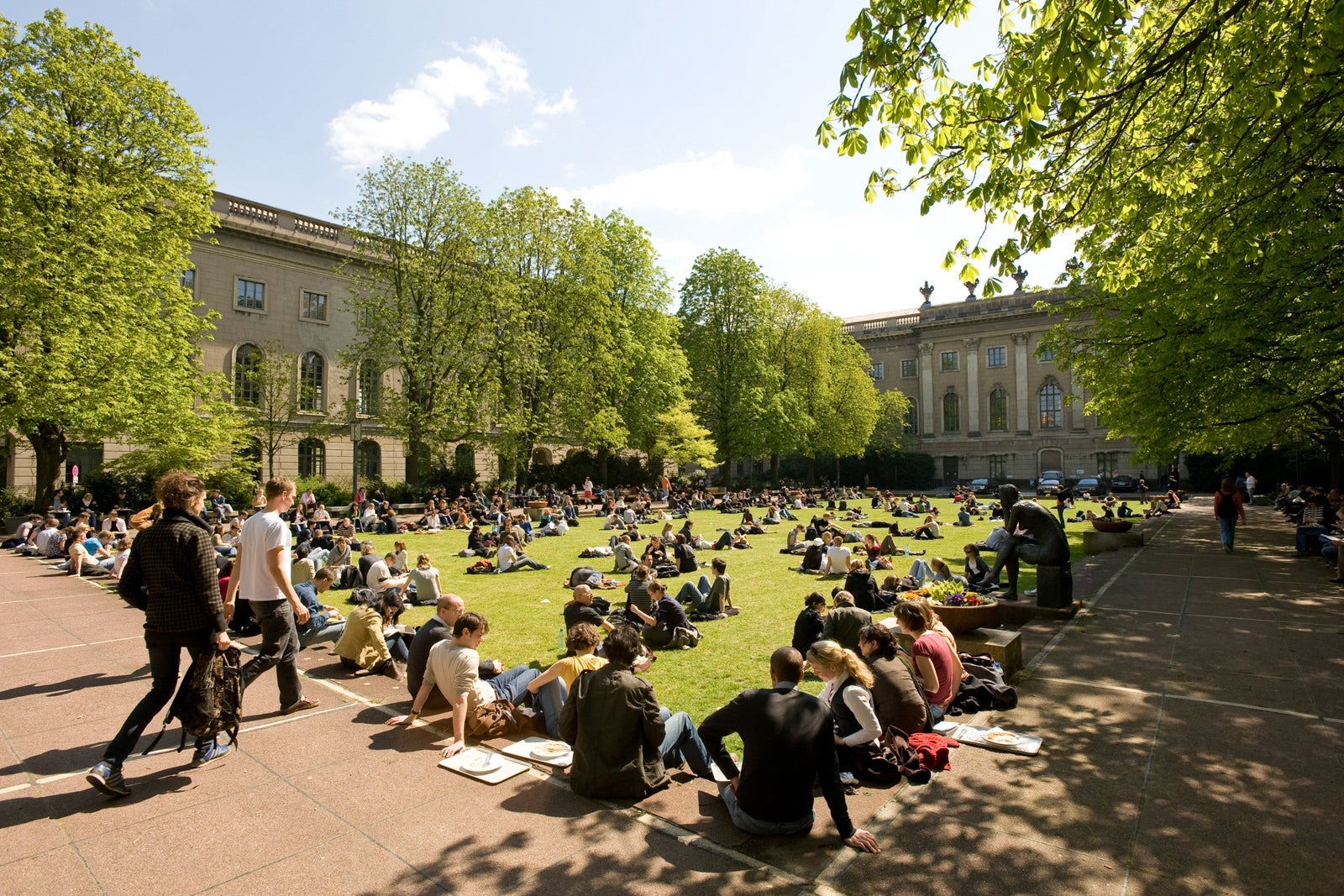 Students sitting on campus grounds