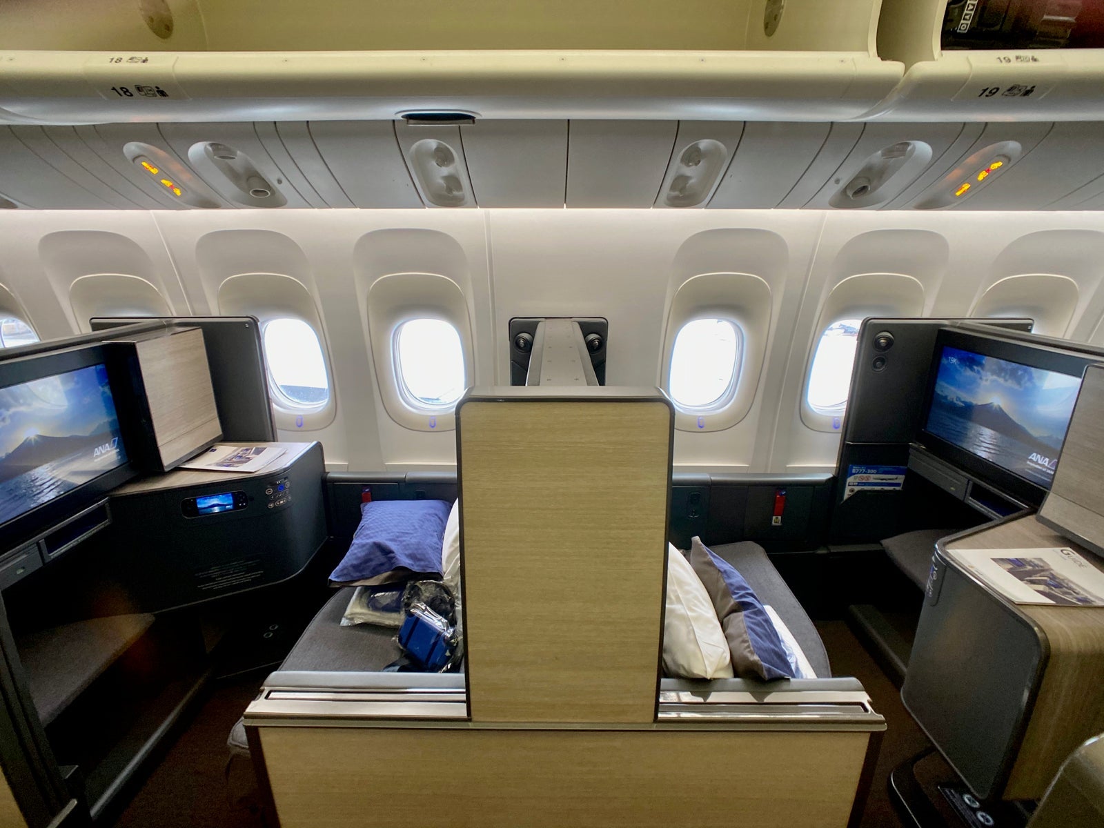 back-to-back seats in a business class cabin of a plane