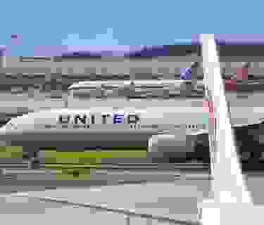 A United Airlines Boeing 777 aircraft waits to take off at Beijing airport on July 25, 2018. - Beijing hailed "positive steps" as major US airlines and Hong Kong's flag carrier moved to comply on July 25 with its demand to list Taiwan as part of China, sparking anger on the island. (Photo by GREG BAKER / AFP) (Photo credit should read GREG BAKER/AFP via Getty Images)