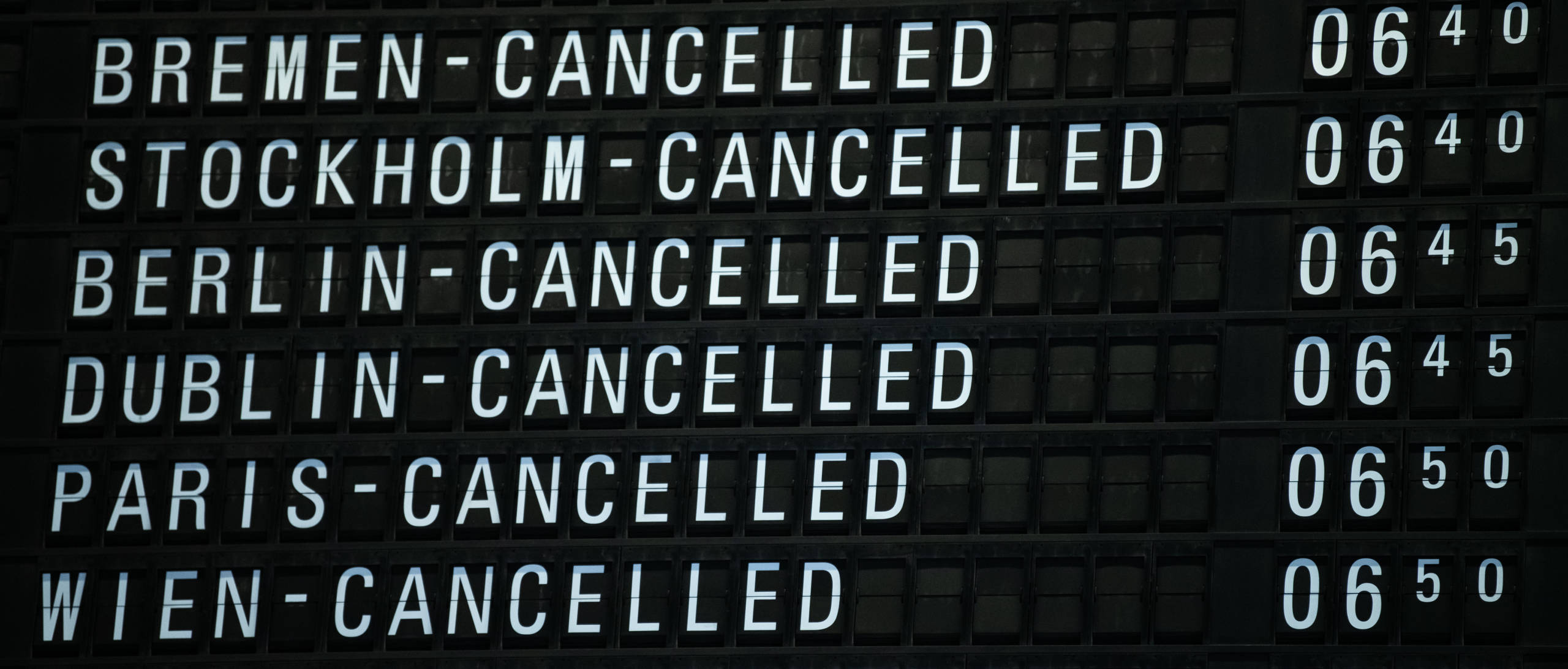 Sign with flights canceled at airport