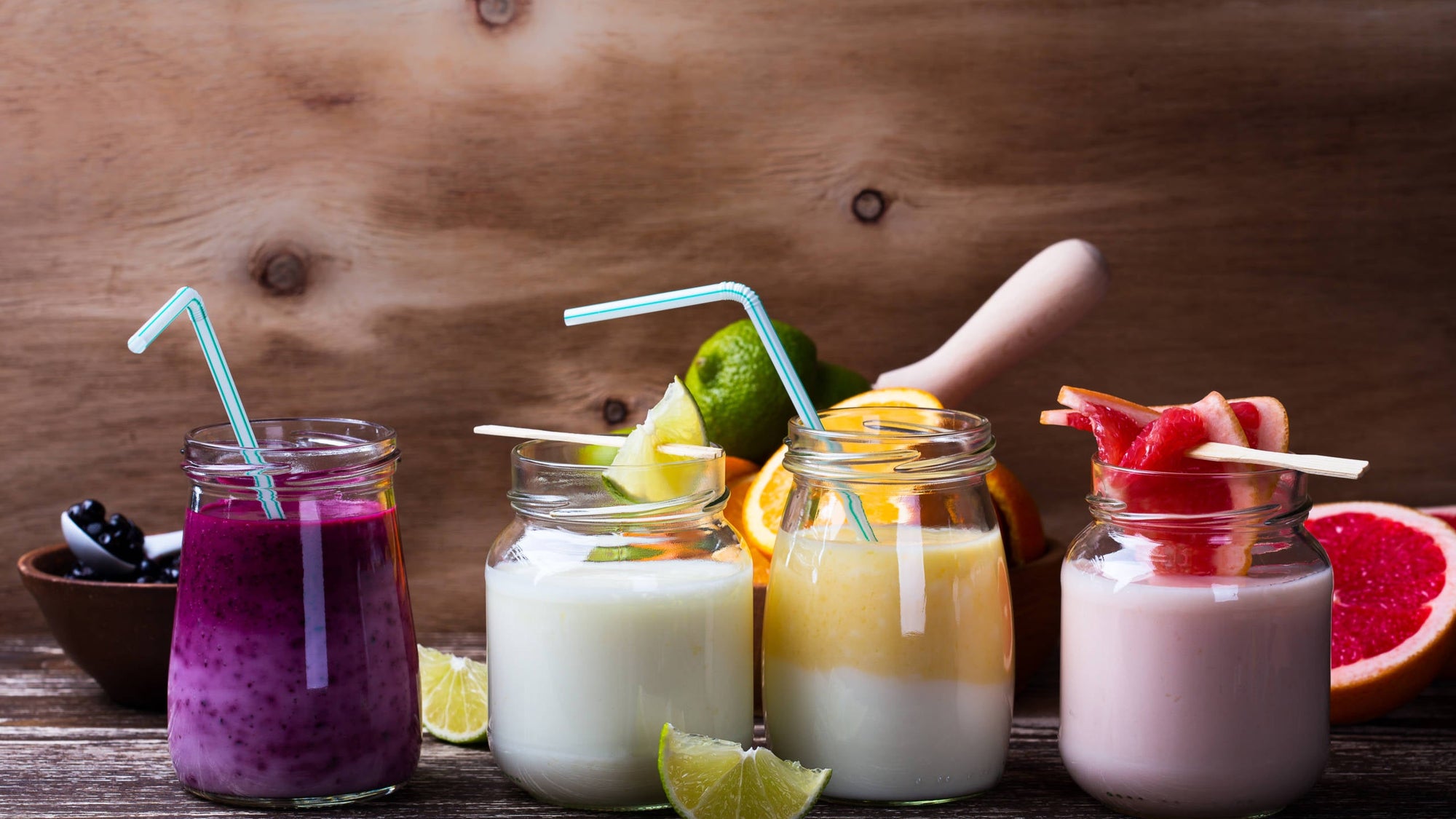 Homemade yogurt with  fresh organic blueberries, lime juice, orange and grapefruit. Berry smoothie bar