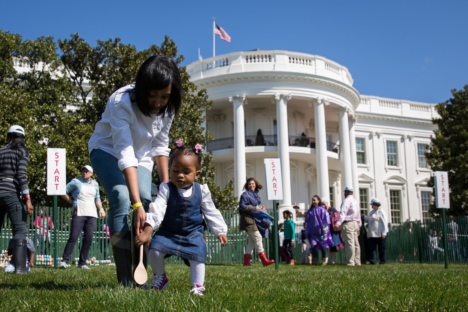 WASHINGTON, DC - MARCH 28: One year-old Ava Johnson plays a game during the annual White House Easter Egg Roll on the South Lawn of the White House March 28, 2016 in Washington, DC. The tradition dates back to 1878 when President Rutherford B. Hayes allowed children to roll eggs on the South Lawn. (Photo by Drew Angerer/Getty Images)