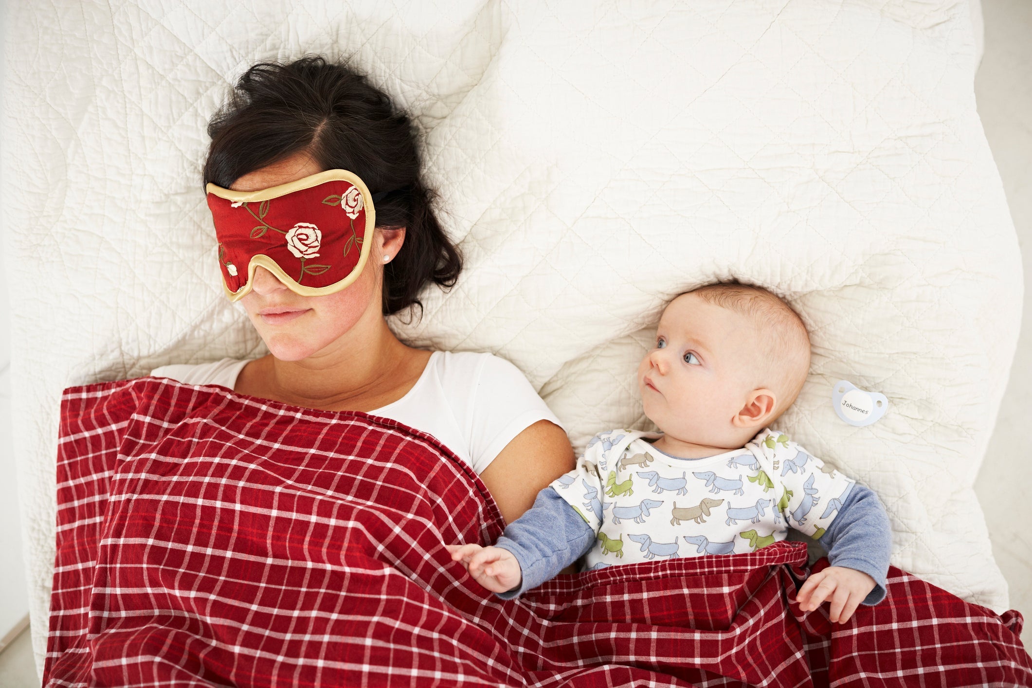 mom with sleeping mask and baby