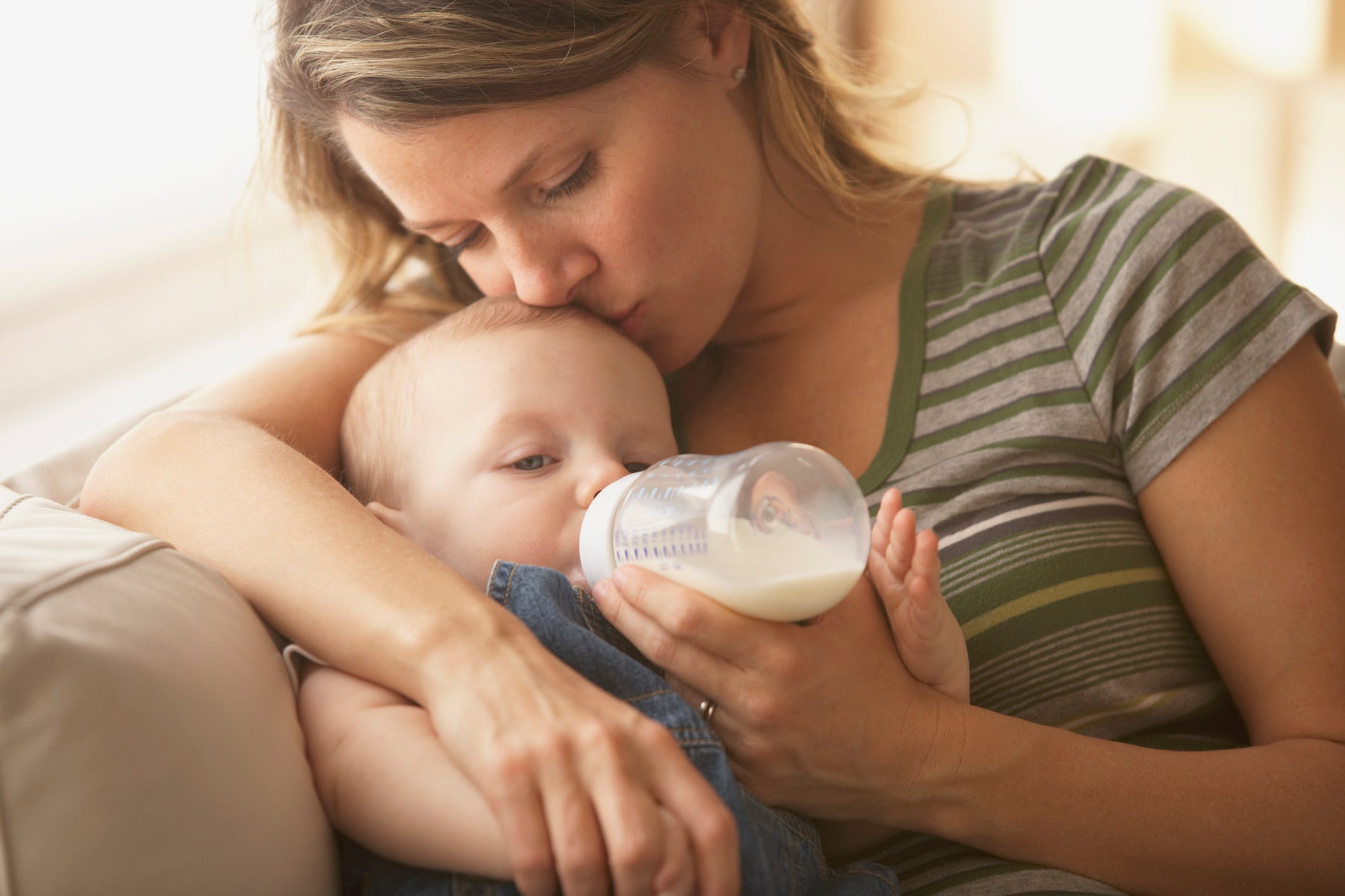 mom bottle feeding baby