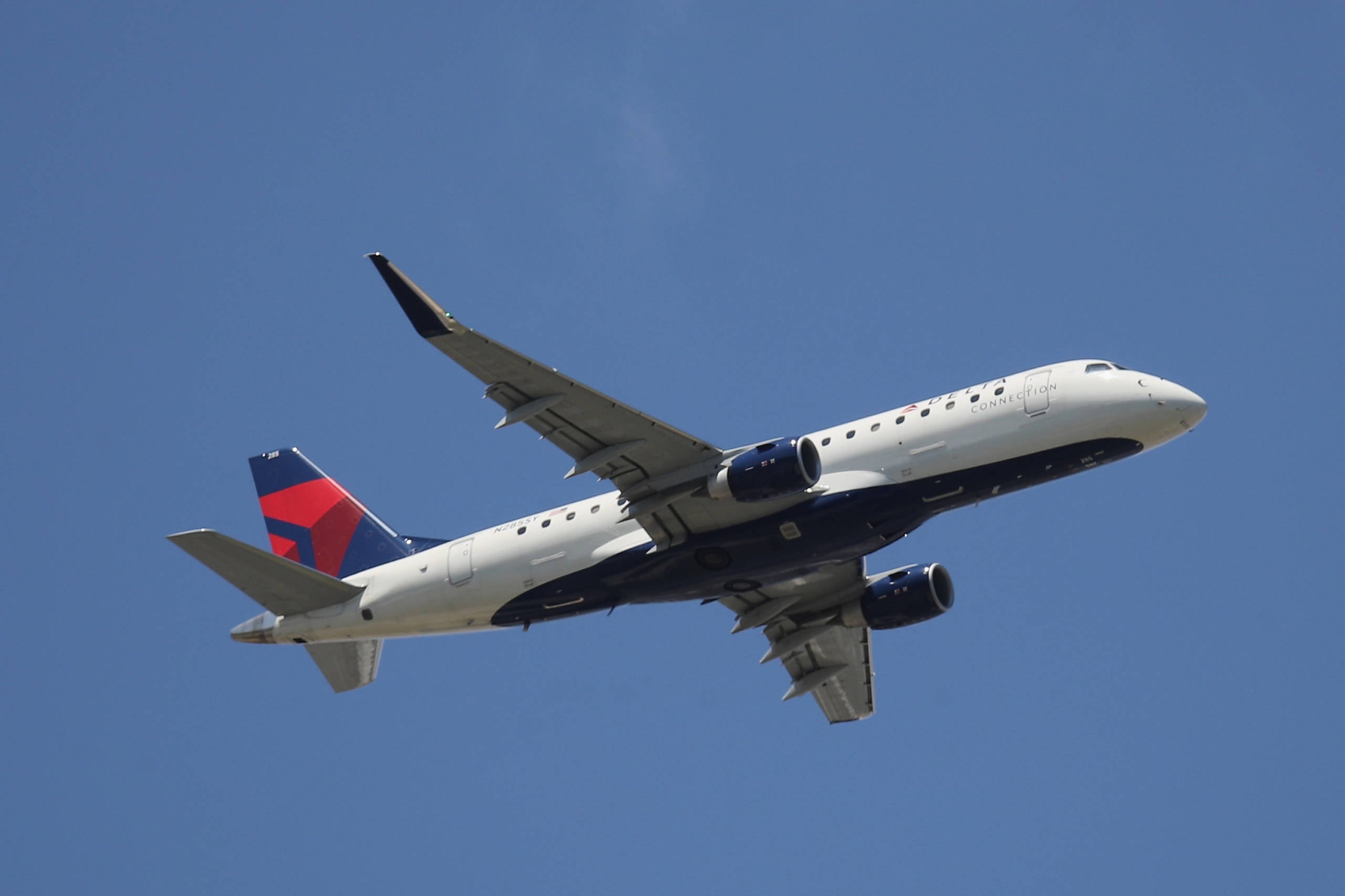 A Delta Connection Embraer ERJ-175 takes off from JFK Airport on Aug. 24, 2019. (Photo by Bruce Bennett/Getty Images)