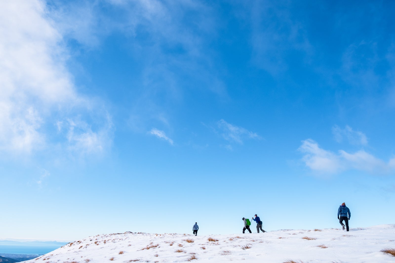 Hiking the snowy mountains of Kahurangi National Park. (Photo via Shutterstock)