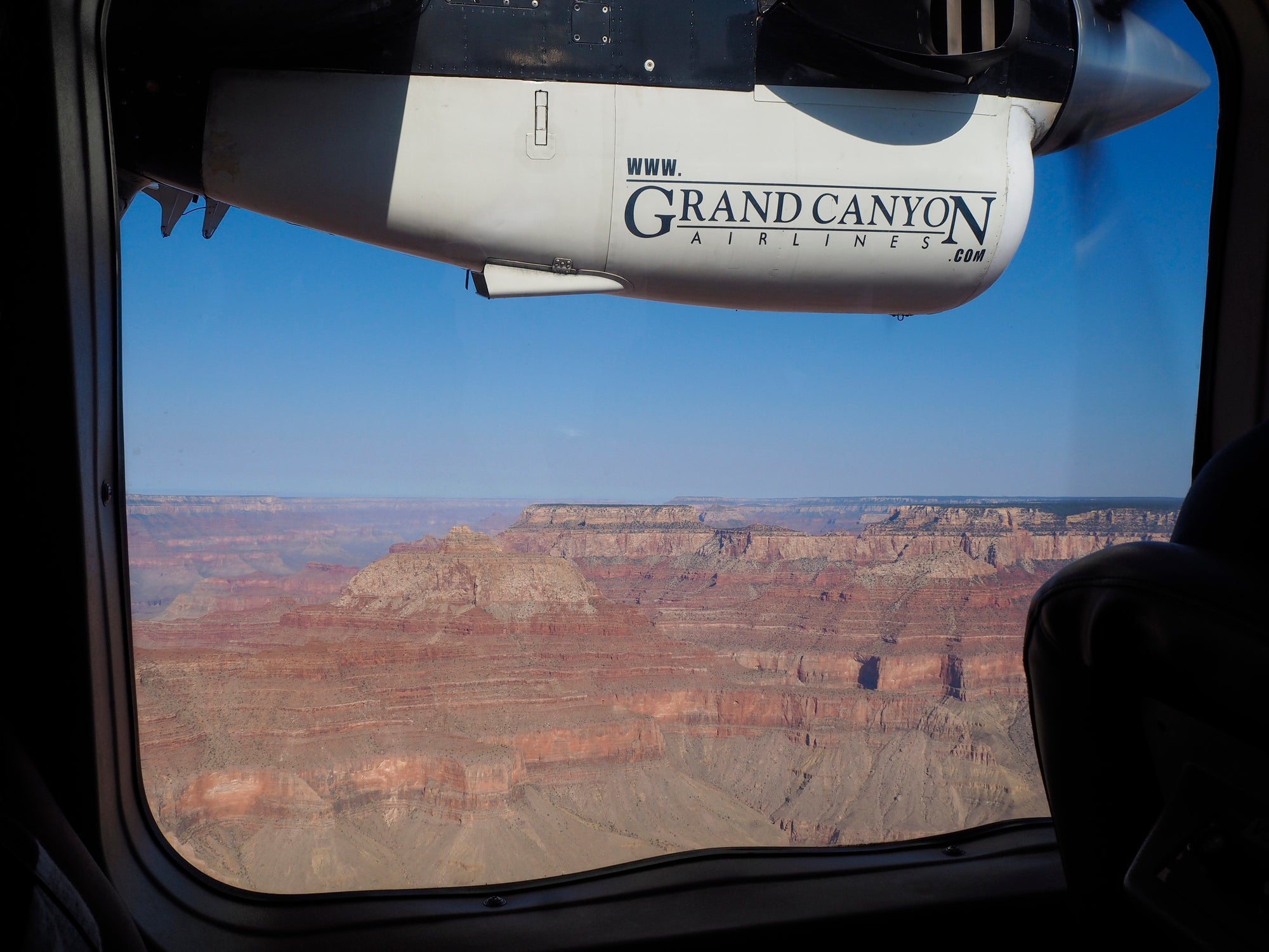 A charter flight sightseeing above the Grand Canyon National Park (Photo by Thamerpic/Getty Images).