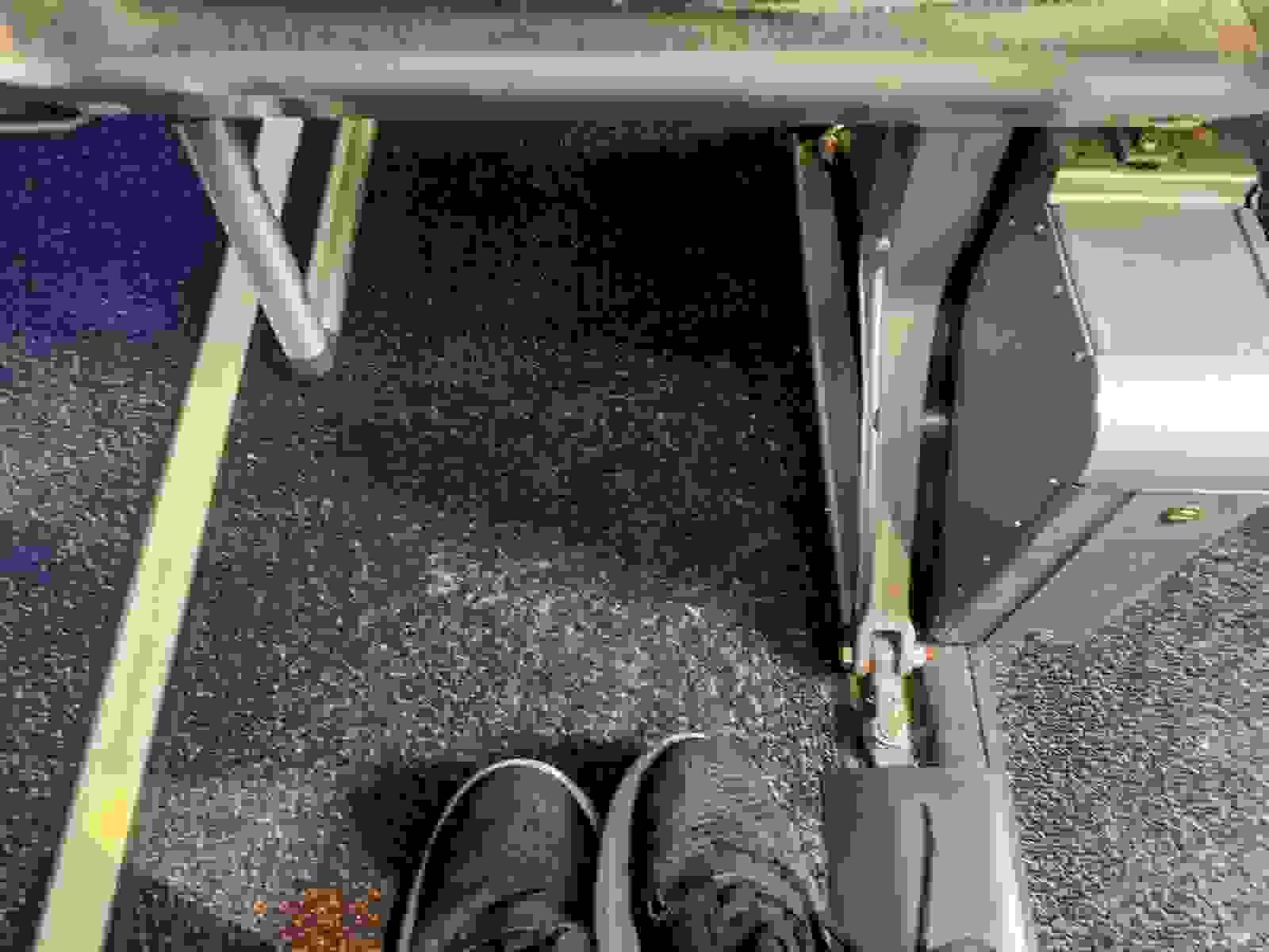 Limited foot space on Alaska Airlines coach seat. (Photo by Clint Henderson/The Points Guy)