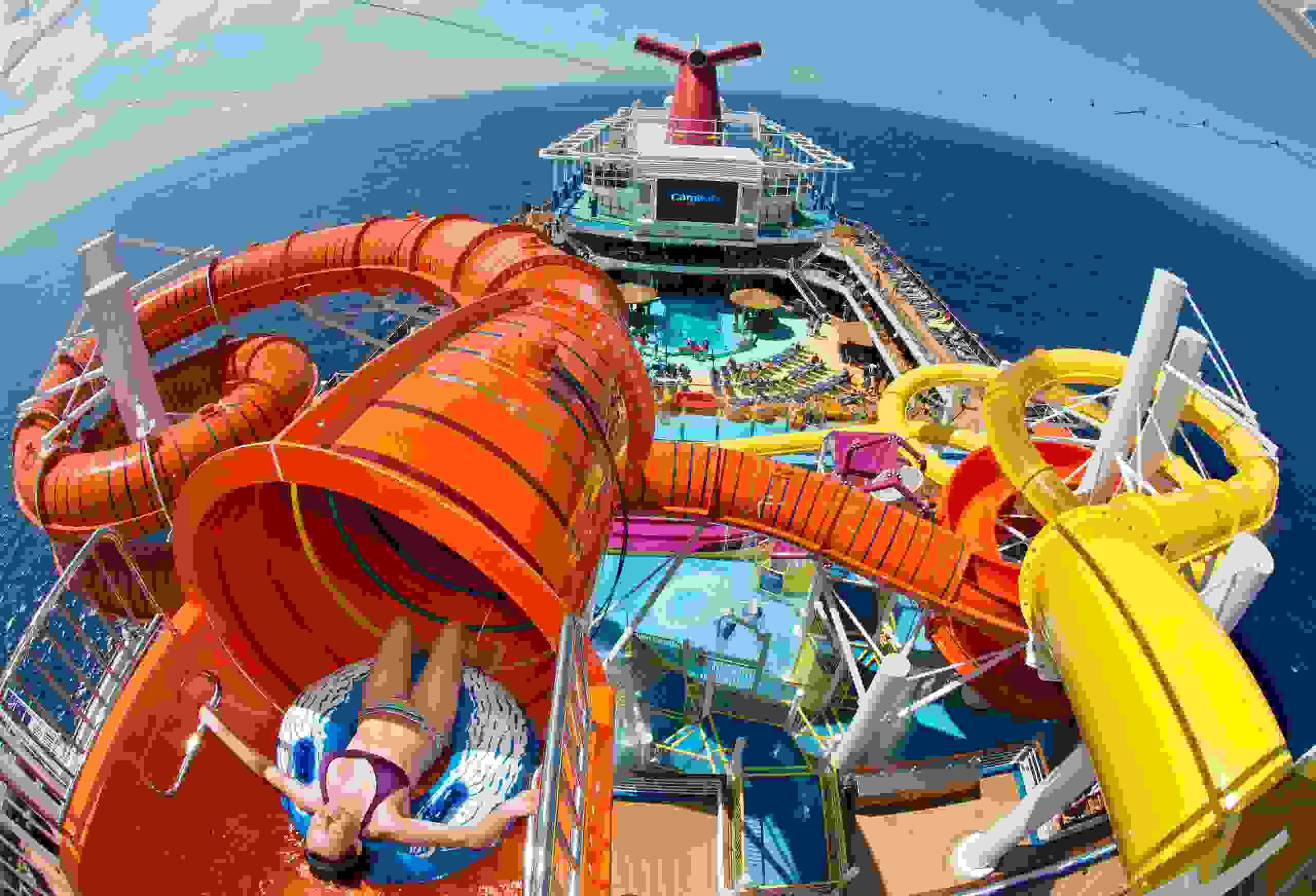 A passenger on Carnival Cruise Line's Carnival Vista prepares to slide down the ship's Kaleid-O-Slide. The water tube attraction is part of the vessel's WaterWorks waterpark area. (Photo by Andy Newman/Carnival Cruise Line)