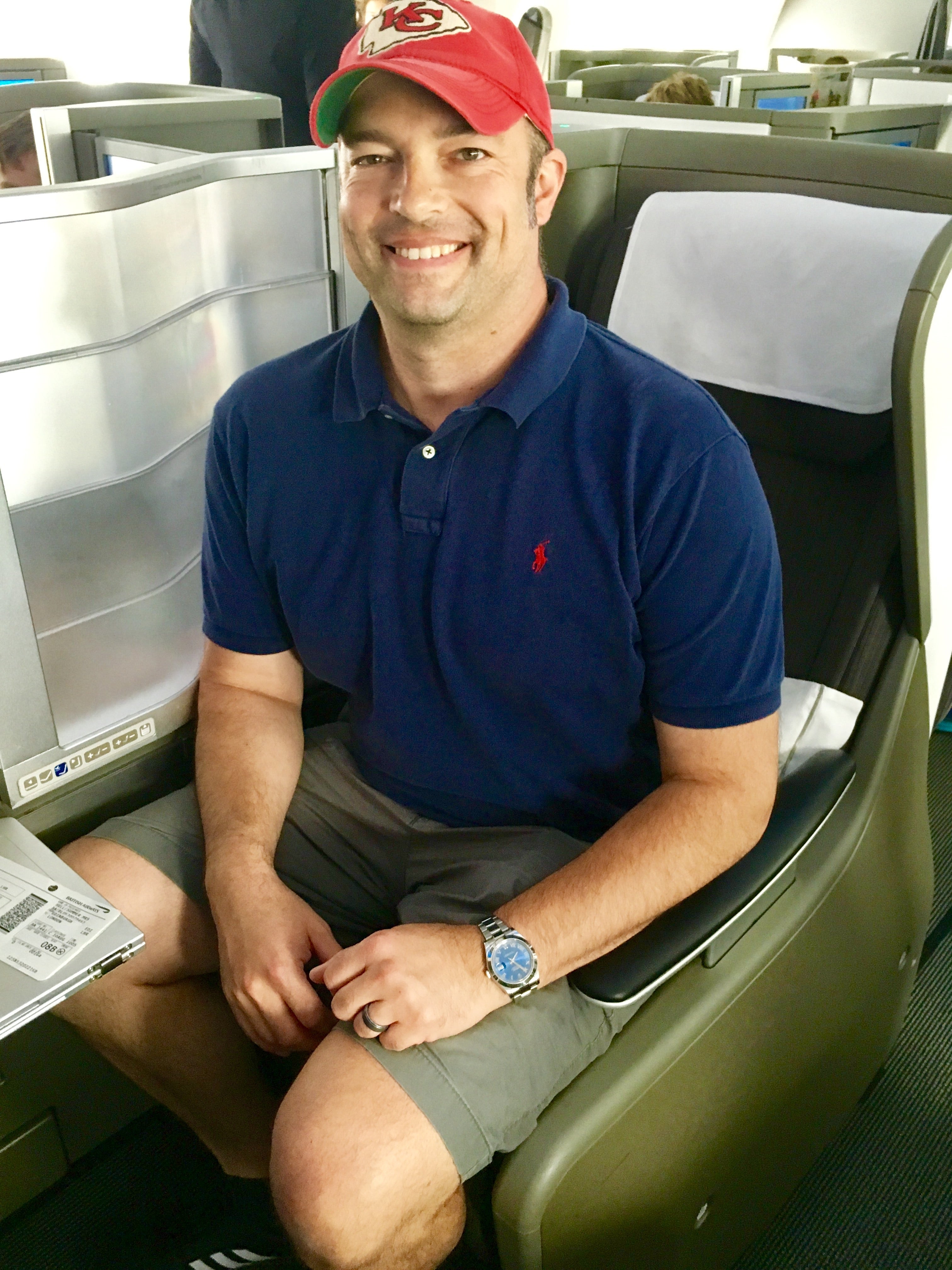 Mommy Points' husband all smiles in business class (Summer Hull / The Points Guy)