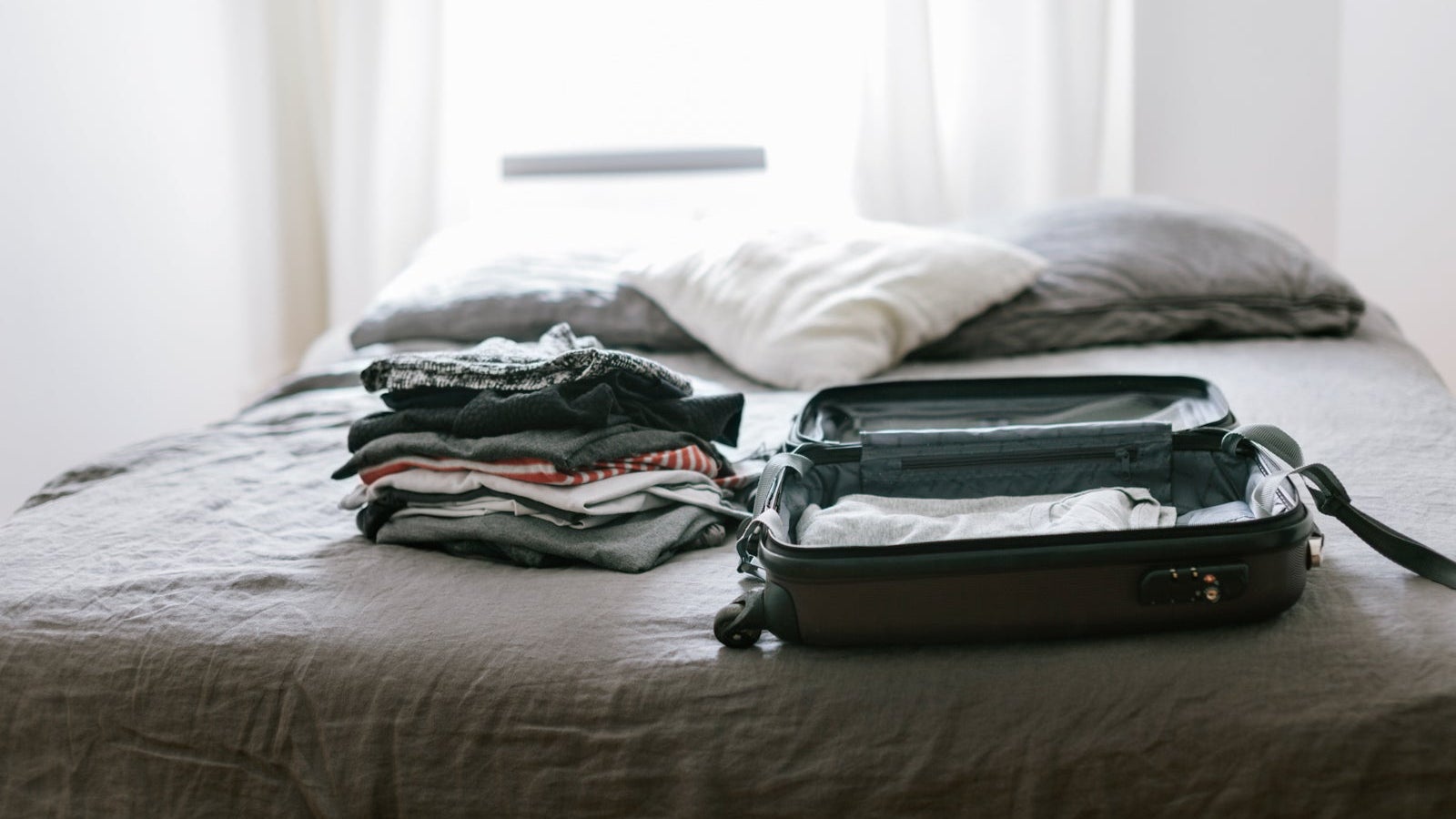 Open suitcase with clothing
