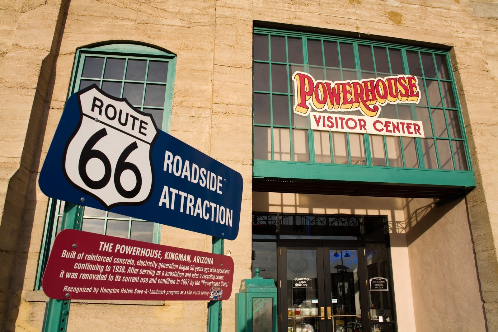 a Route 66 roadside attraction sign outside the entrance to the visitor center