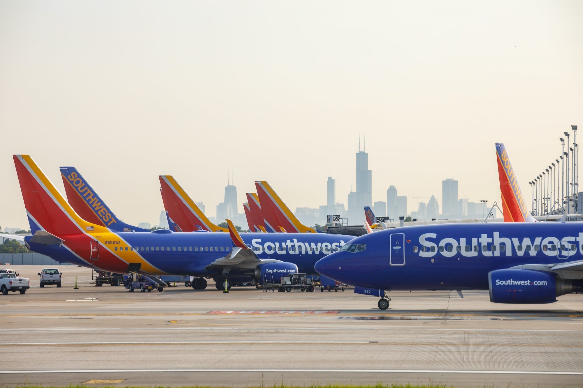 Southwest planes at airport with cityscape in background