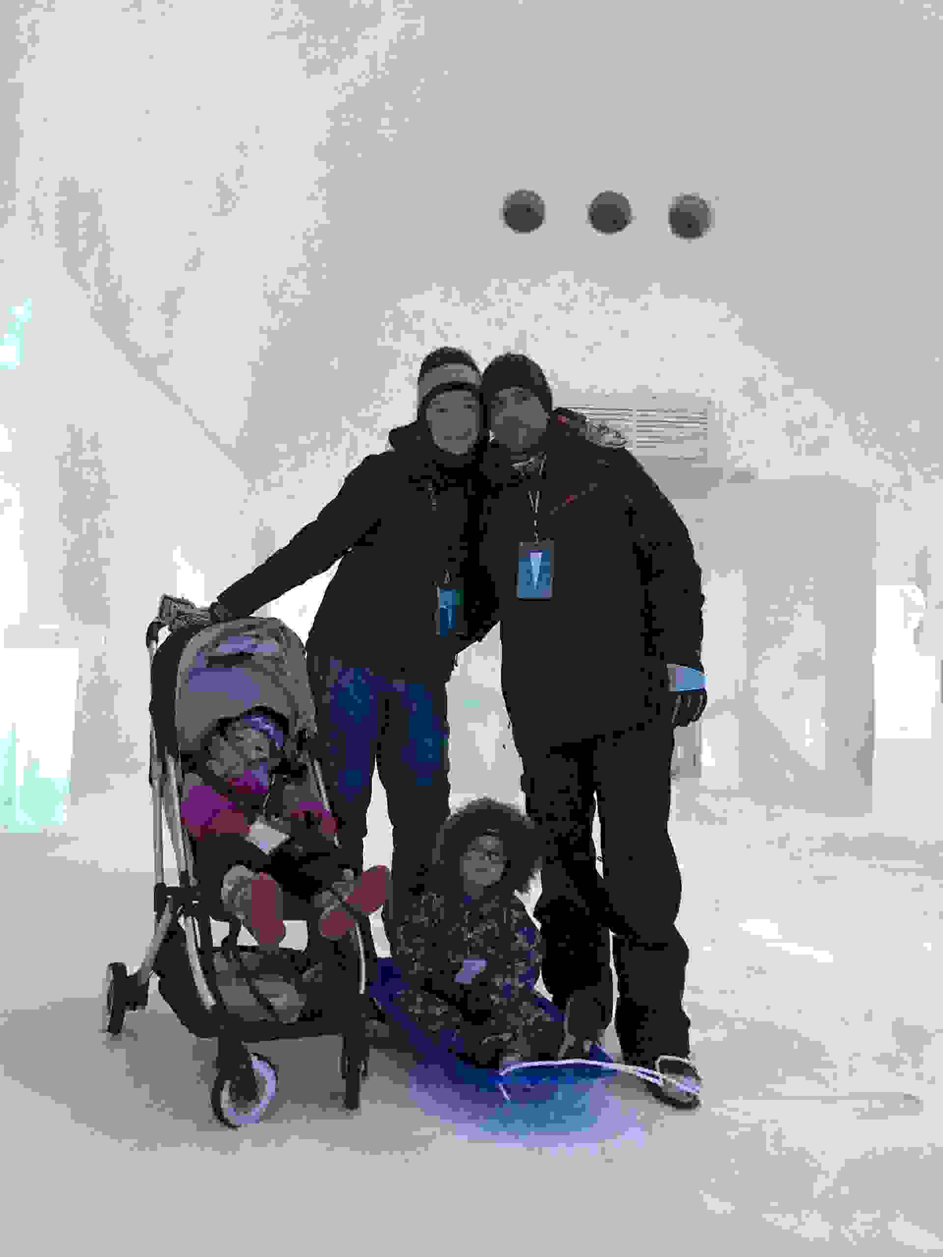 The author and her husband at the ICEHOTEL in Kiruna, Sweden, happy to have a stroller for their bundled-up baby (Terry-Ward.com)