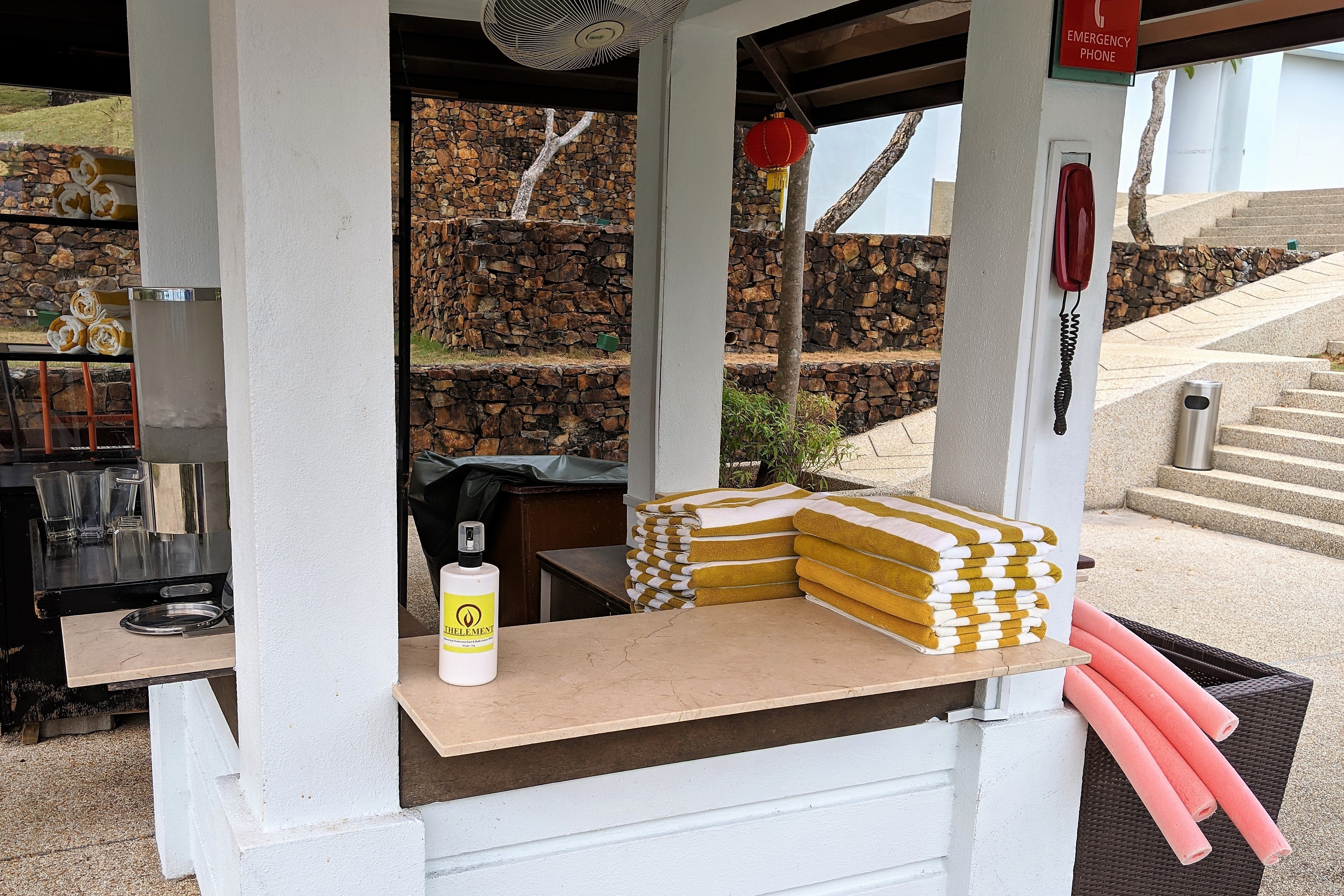 Towels and sunscreen are available by the pools.