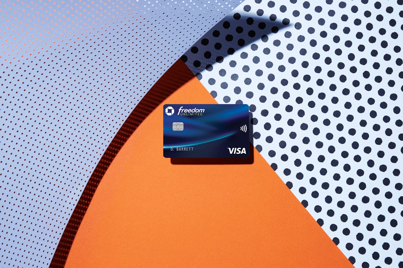 a credit card against a multi-colored background