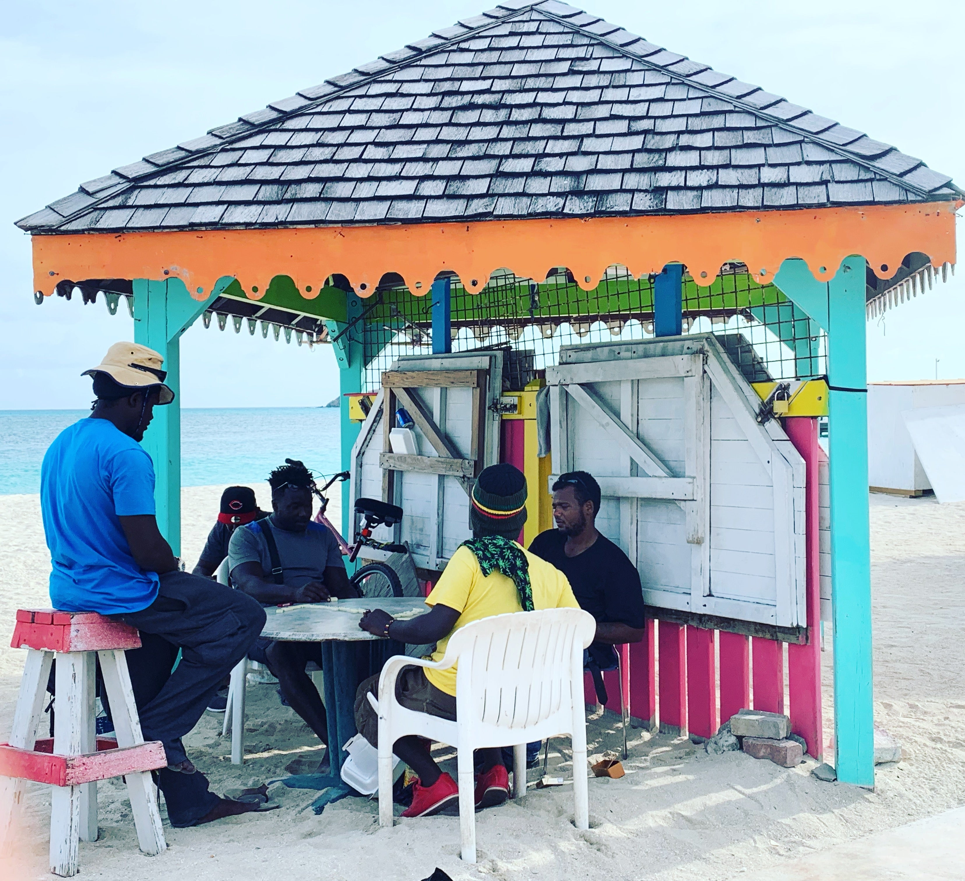 Men enjoying an afternoon on the beach in Philipsburg by Erin Carey