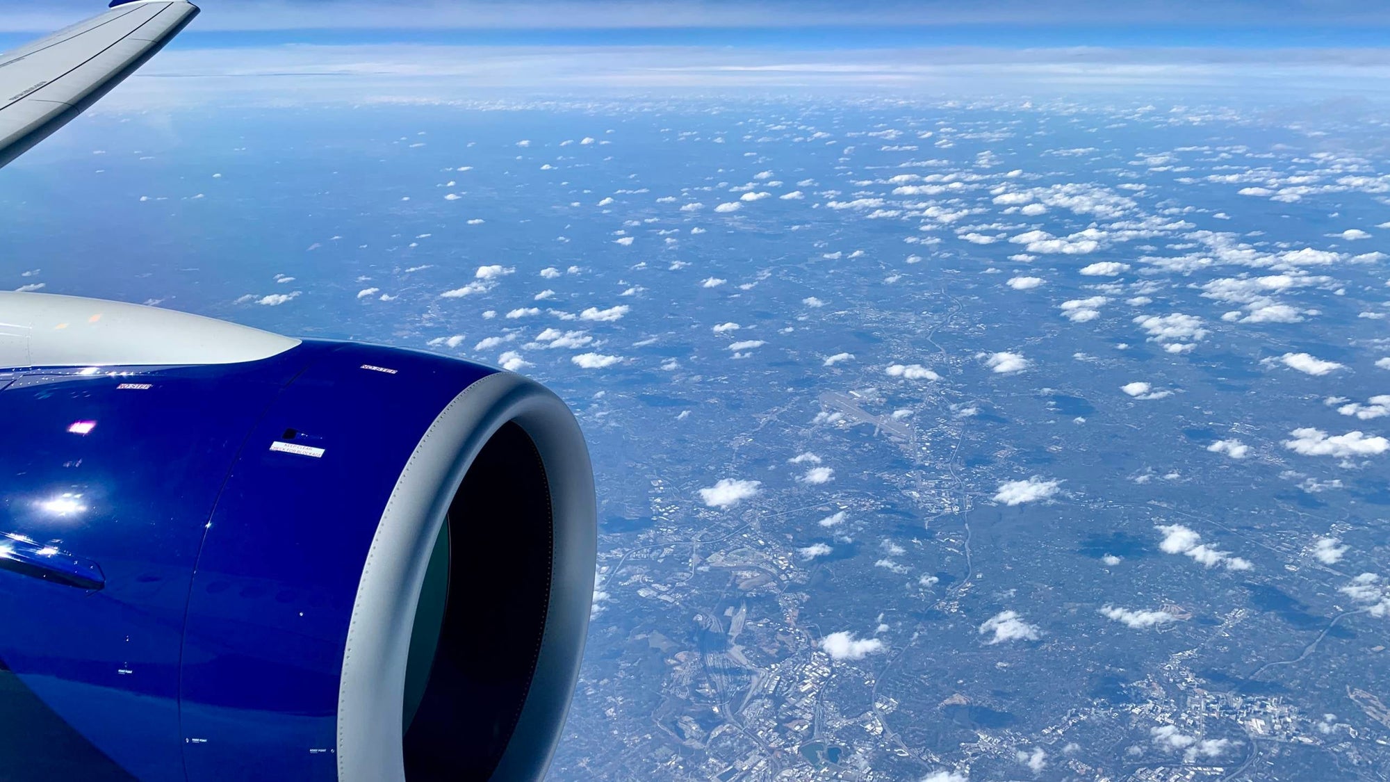 delta-a220-overhead-clouds