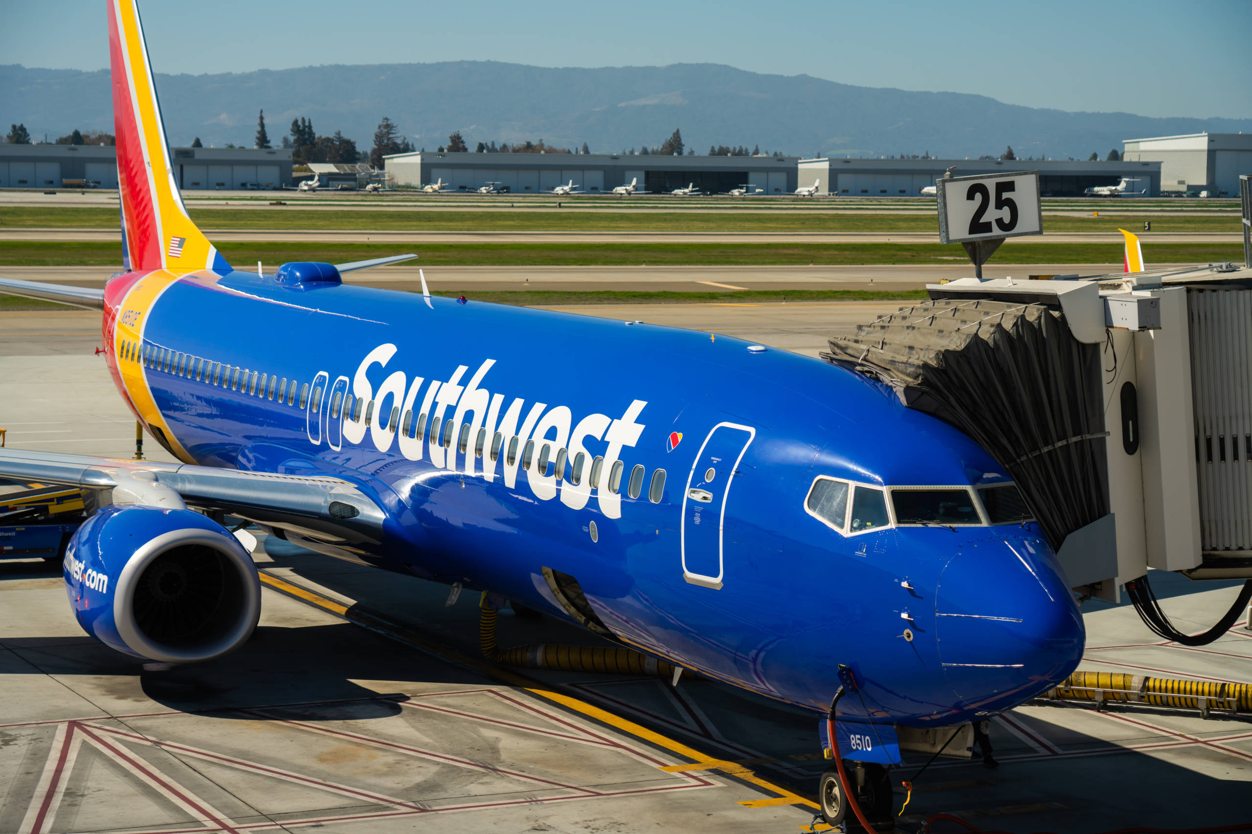 A Southwest Airlines Boeing 737-800 plane parked at a boarding gate