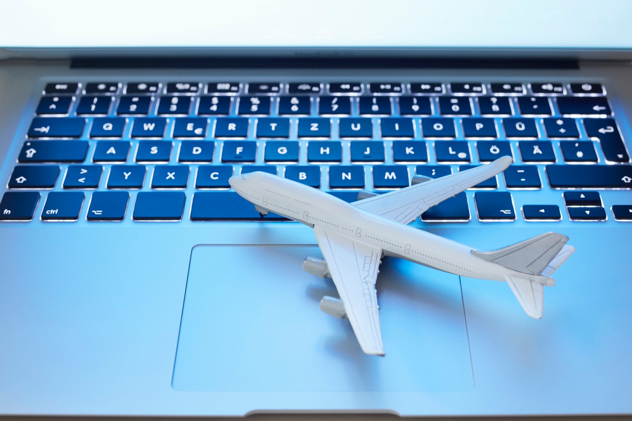 Still life of a small airplane on laptop
