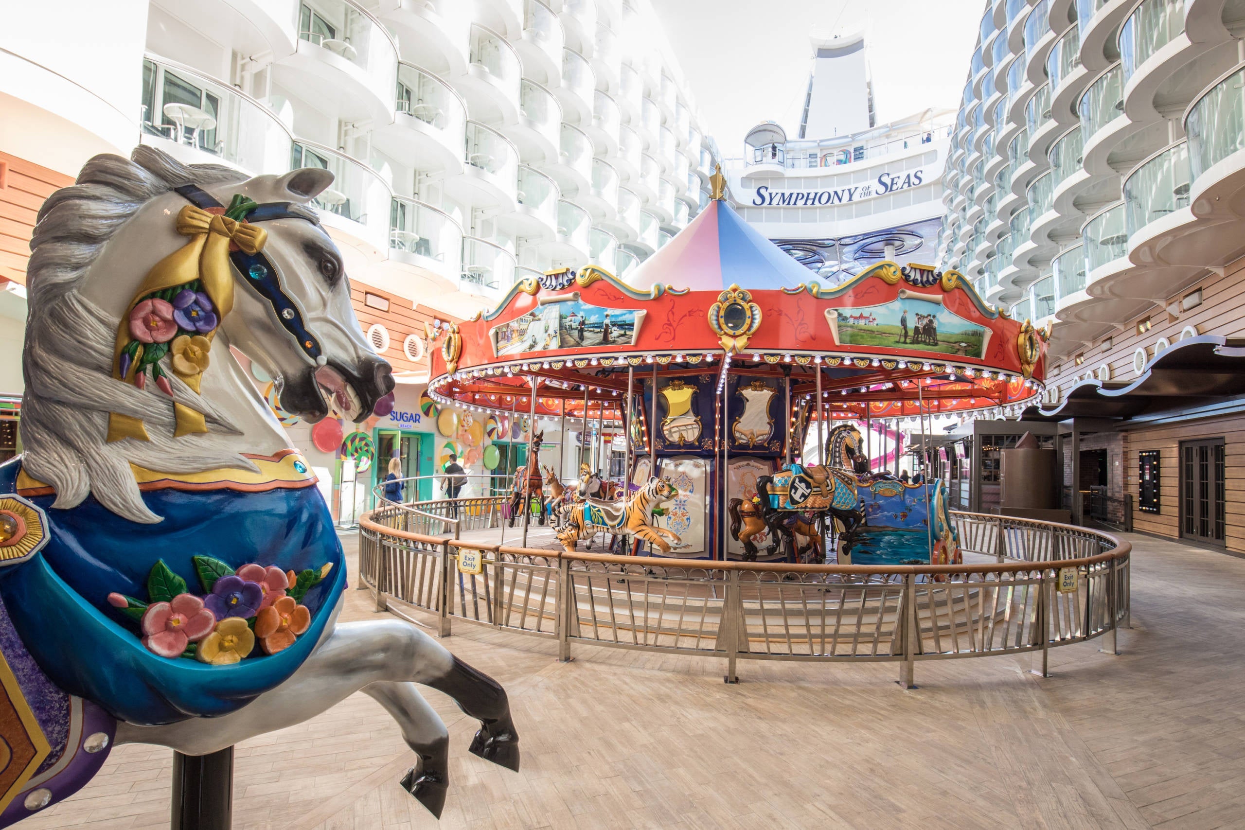 A hand-carved carousel sits at the center of the Boardwalk area on Royal Caribbean’s Symphony of the Seas.