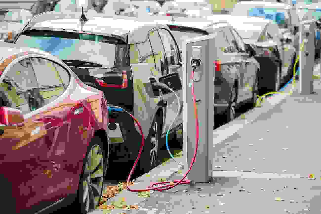 Electric Cars Charging on City Street