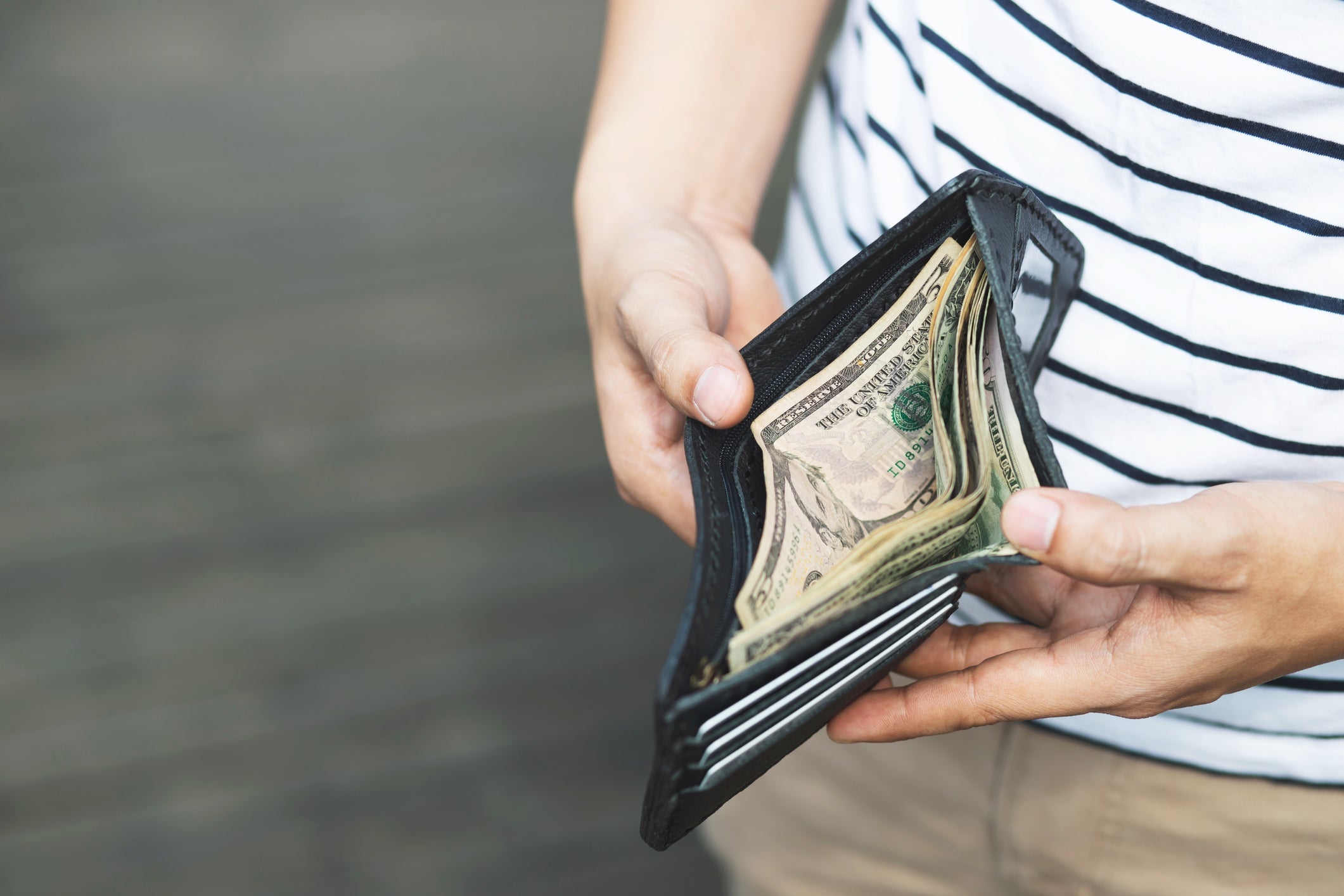 Person opening wallet