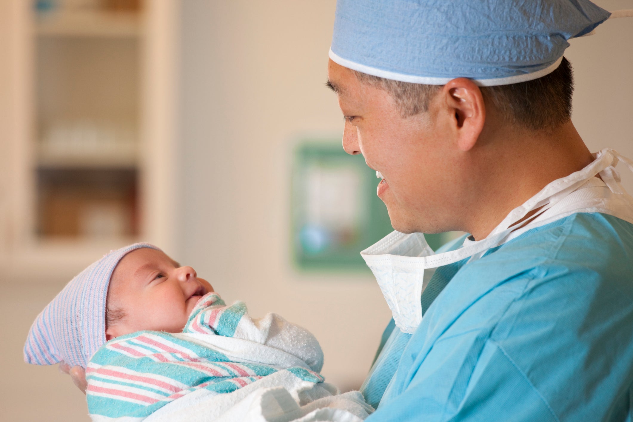 newborn baby and doctor