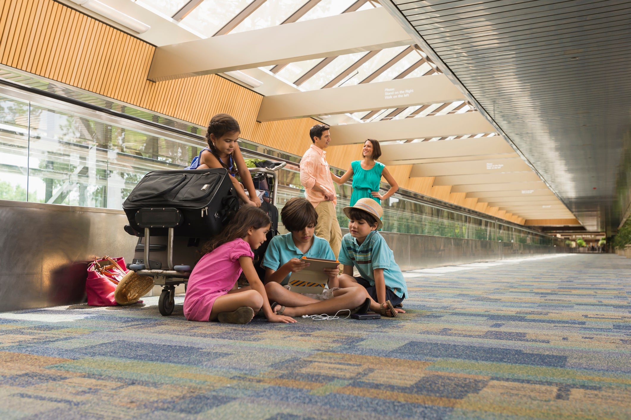 kids w/ bags at airport
