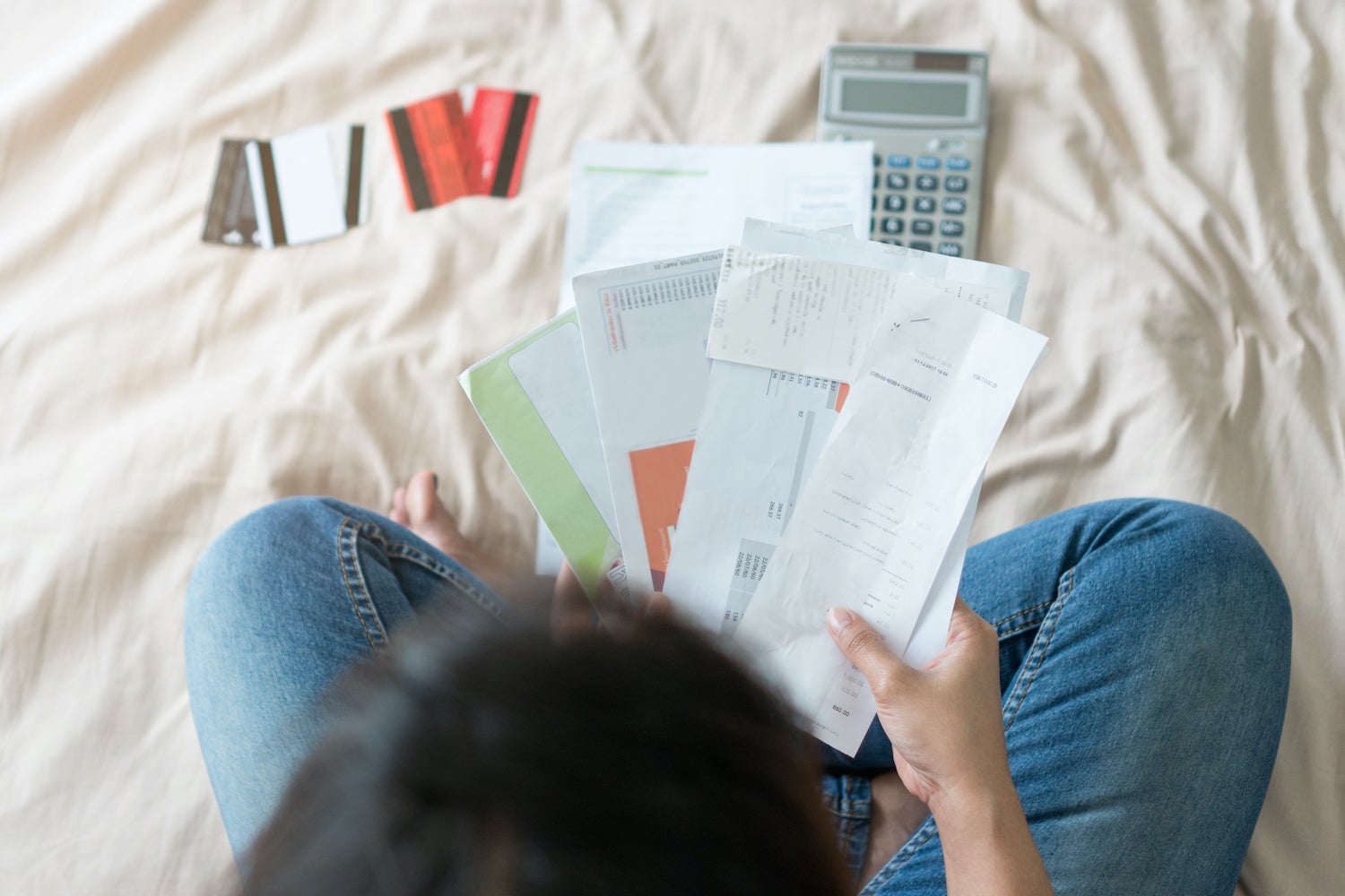 Person Looking at Credit Card Bills