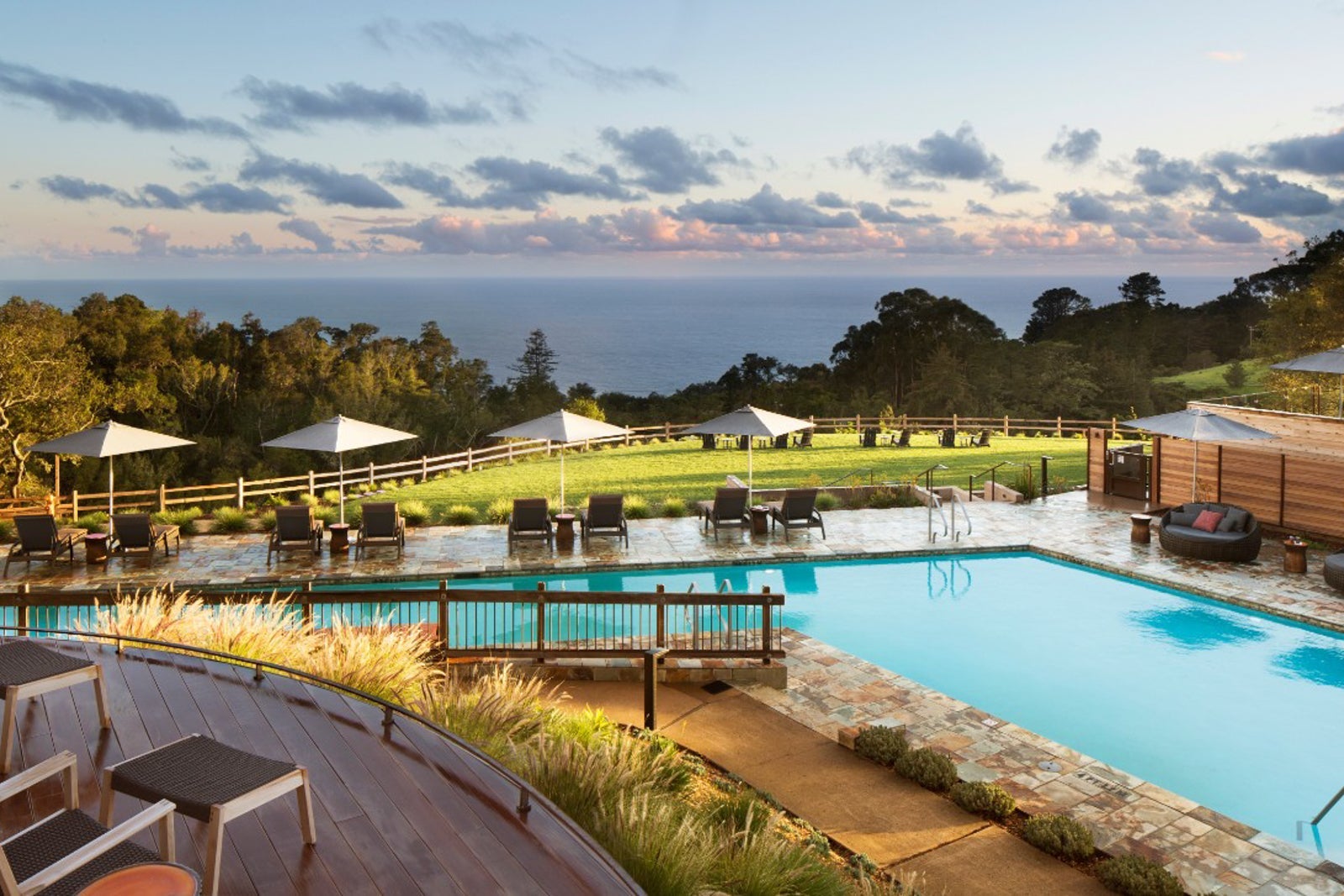 Image of the pool at Ventana Big Sur and the Pacific Ocean in the background.