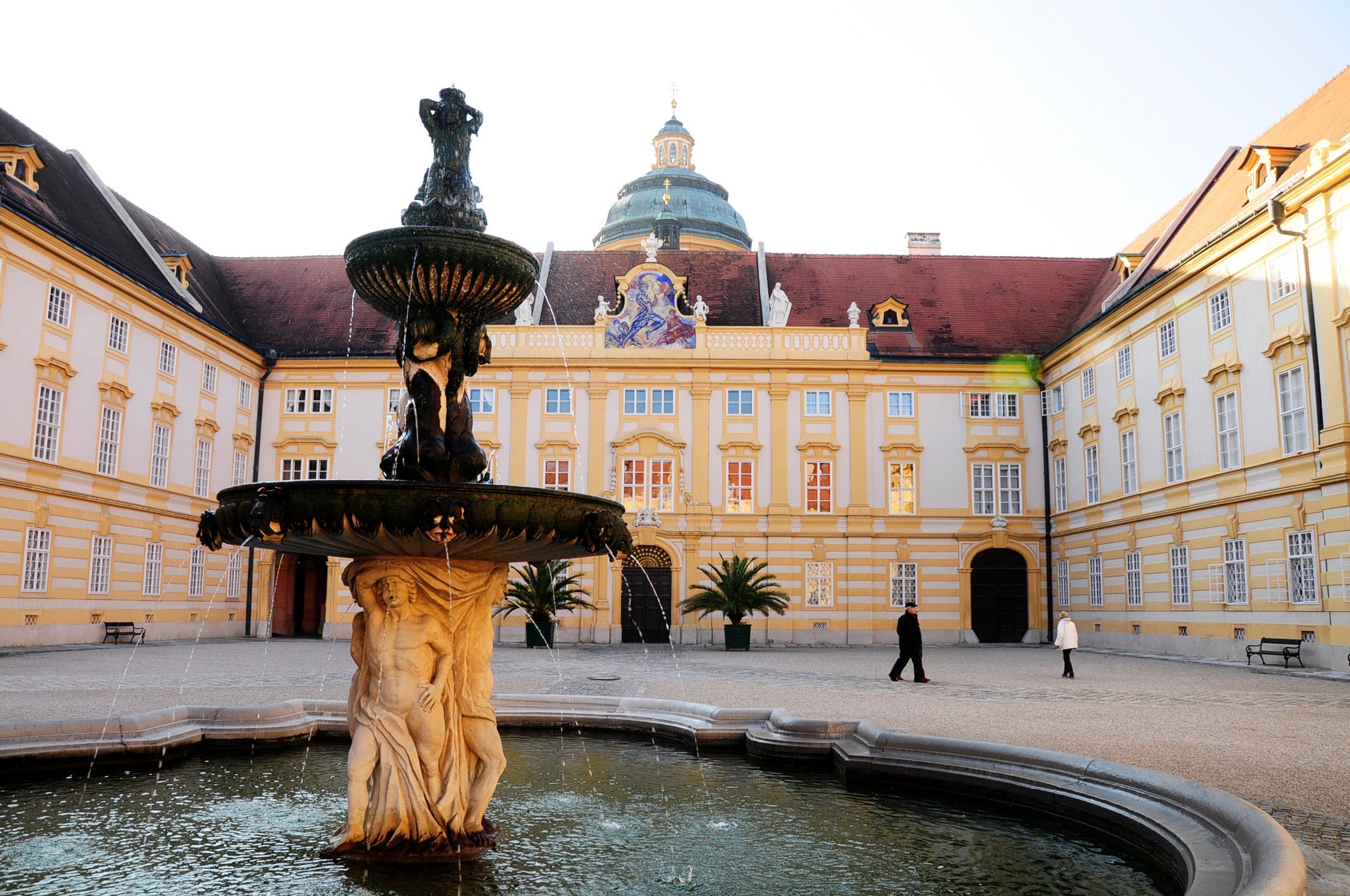 Melk Abbey or Stift Melk is an Austrian Benedictine abbey, and one of the world's most famous monastic sites. It is located above the town of Melk on a rocky outcrop overlooking the river Danube in Lower Austria. The impressive Baroque ensemble at Melk was built in 1702-1736 by architect Jakob Prandtauer. Especially noteworthy is the church with magnificent frescoes by Johann Michael Rottmayr and the library containing countless medieval manuscripts.