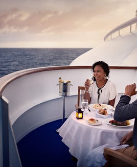 Couple dining on their Princess cruise ship balcony