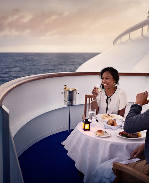 Couple dining on their Princess cruise ship balcony