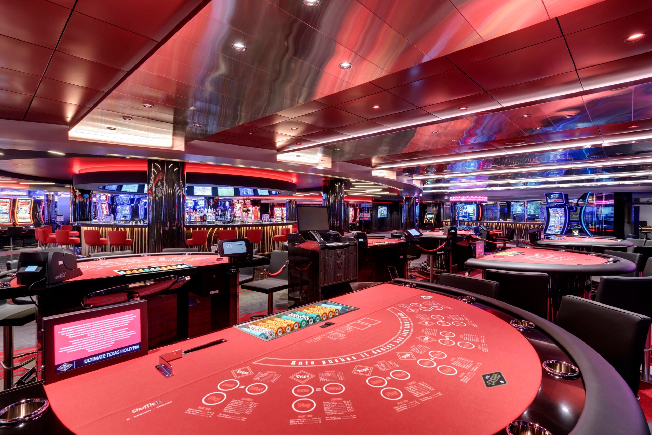 Red gaming tables in a cruise ship casino